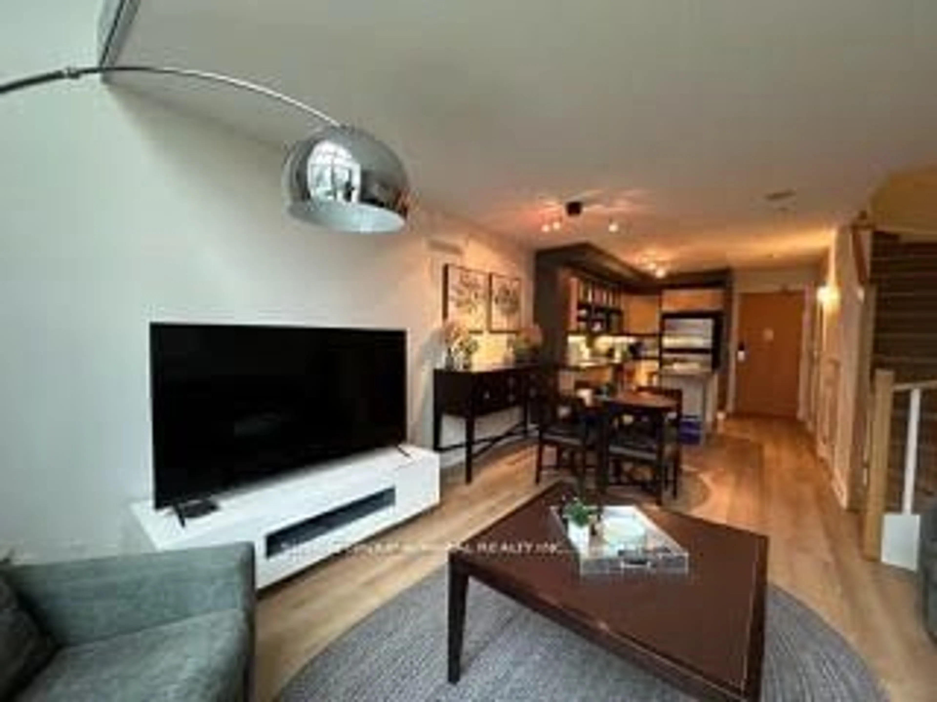 Living room with furniture, wood/laminate floor for 36 Blue Jays Way #723, Toronto Ontario M5V 3T3