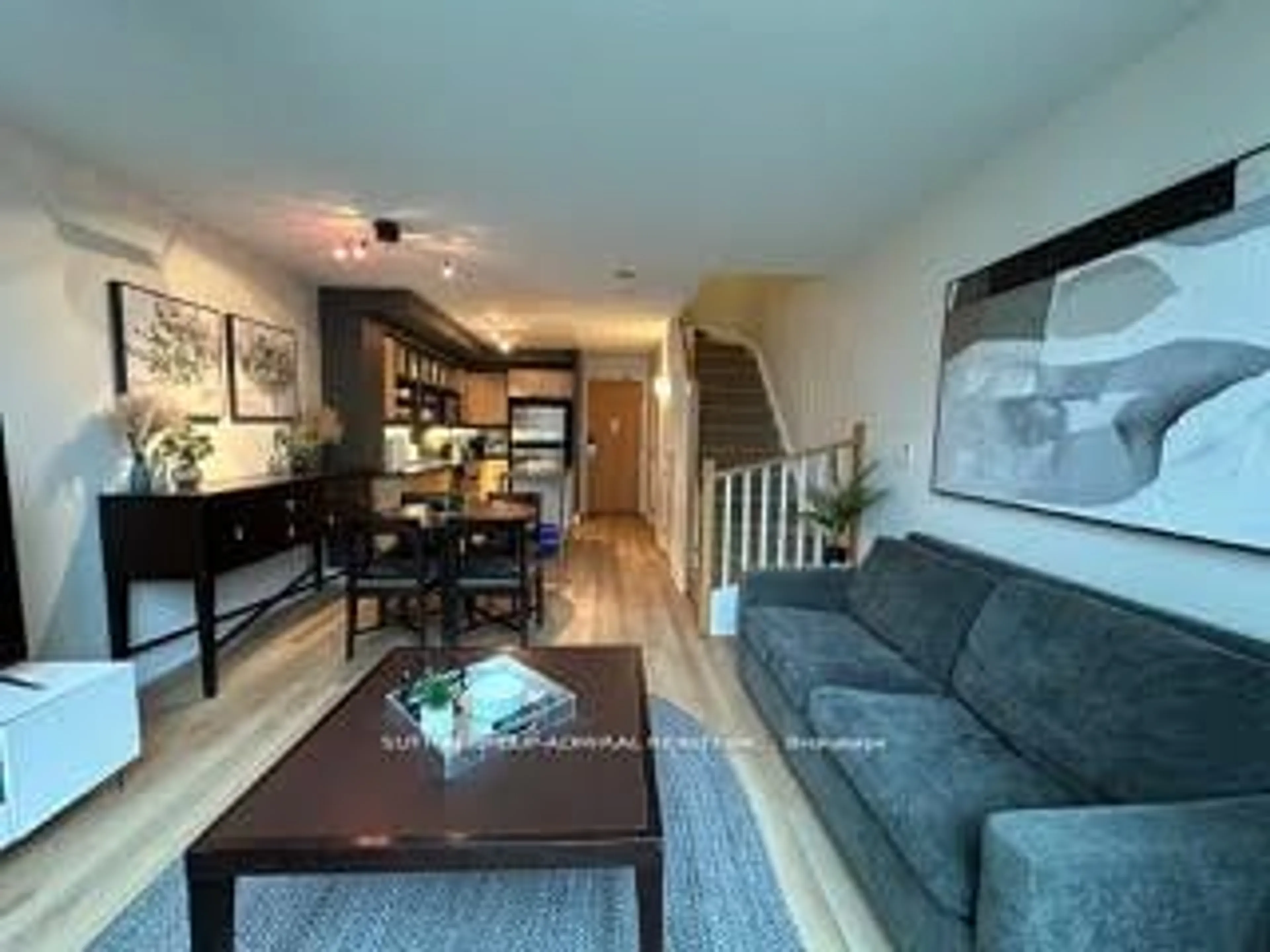 Living room with furniture, wood/laminate floor for 36 Blue Jays Way #723, Toronto Ontario M5V 3T3