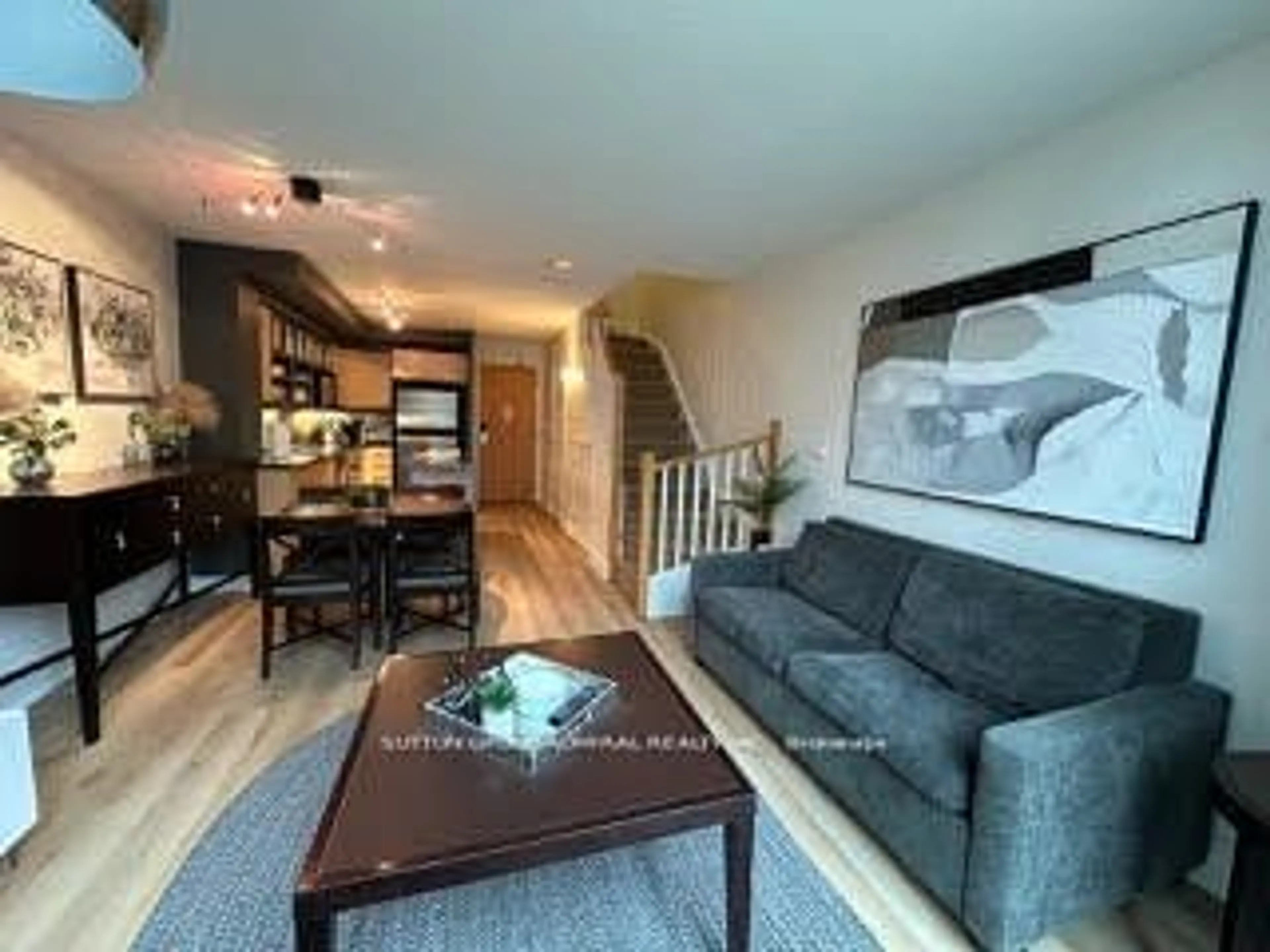 Living room with furniture, wood/laminate floor for 36 Blue Jays Way #723, Toronto Ontario M5V 3T3