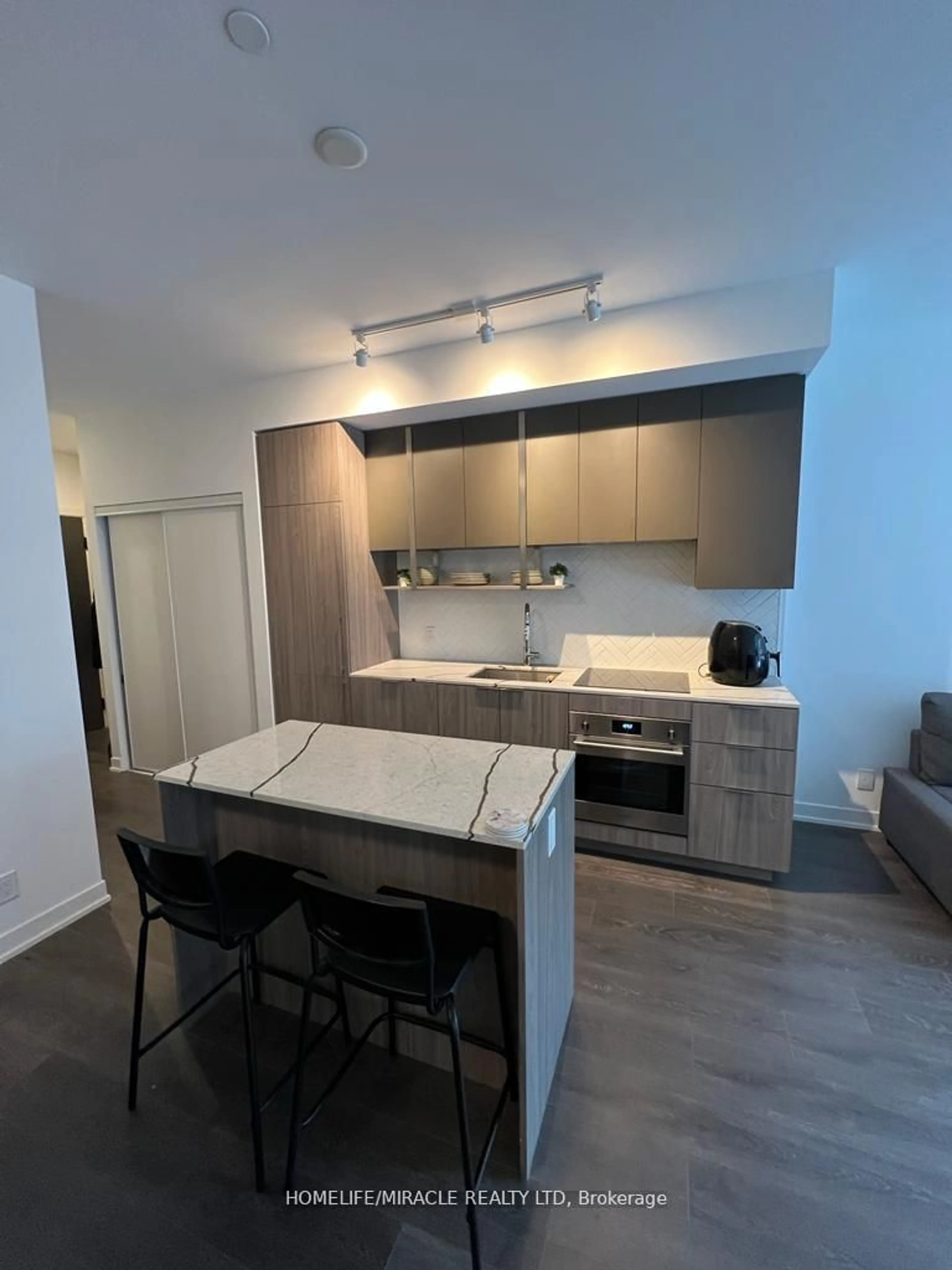 Open concept kitchen, wood/laminate floor for 15 Holmes Ave #316, Toronto Ontario M2N 0L4