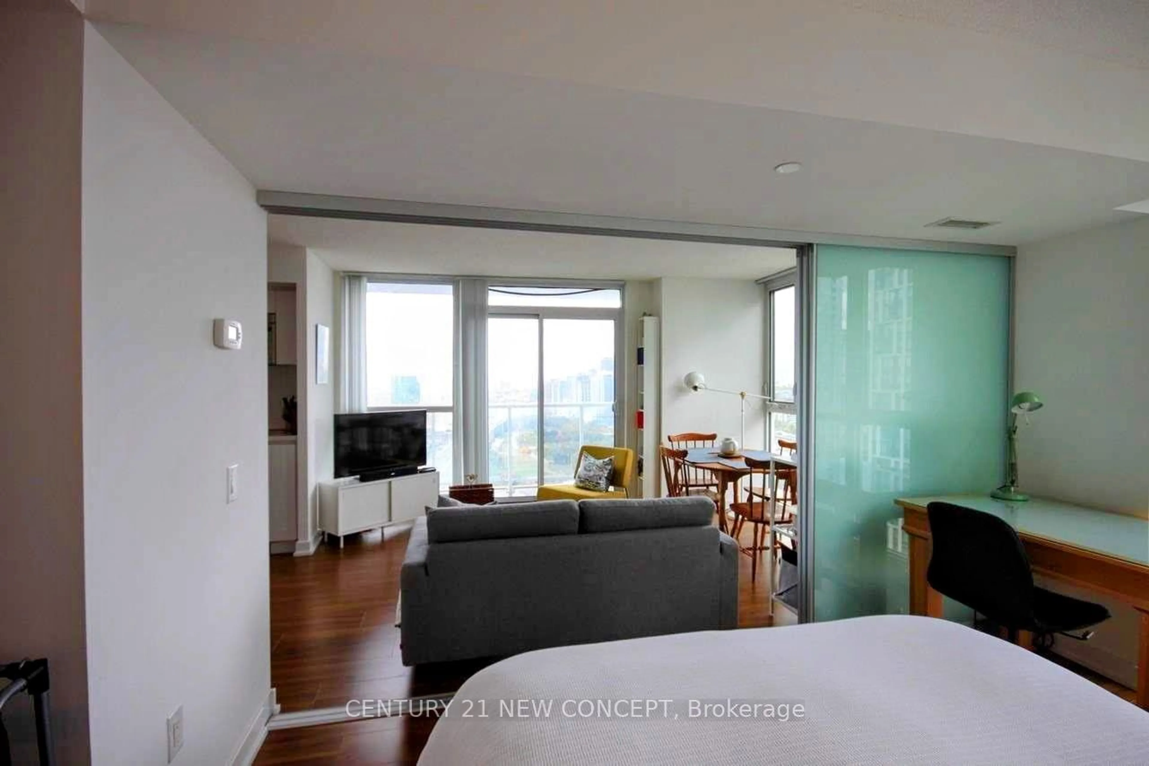 Living room with furniture, wood/laminate floor for 85 Queens Wharf Rd #3307, Toronto Ontario M5V 0J9