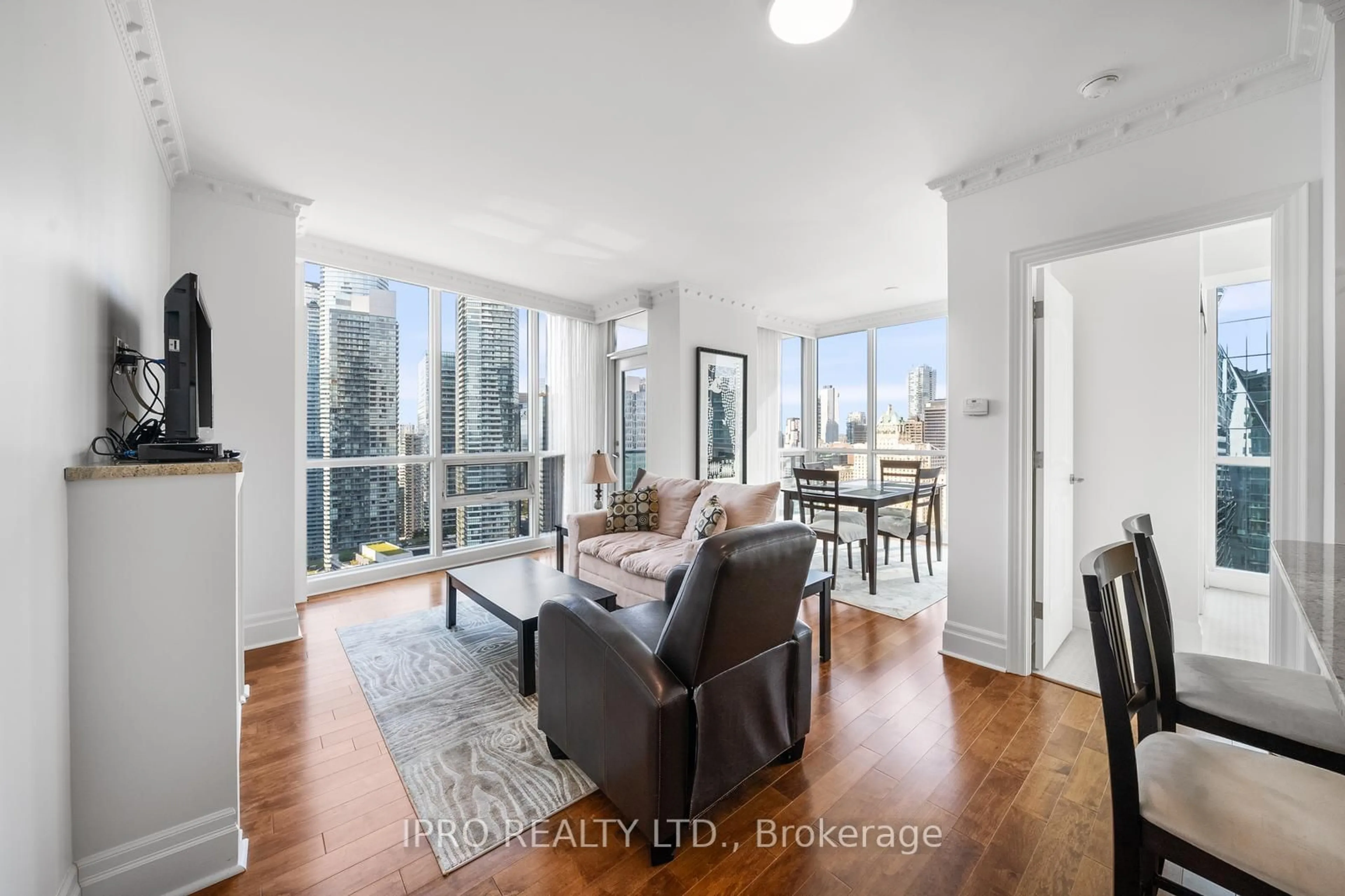 Living room with furniture, wood/laminate floor for 16 Harbour St #3402, Toronto Ontario M5J 2Z7