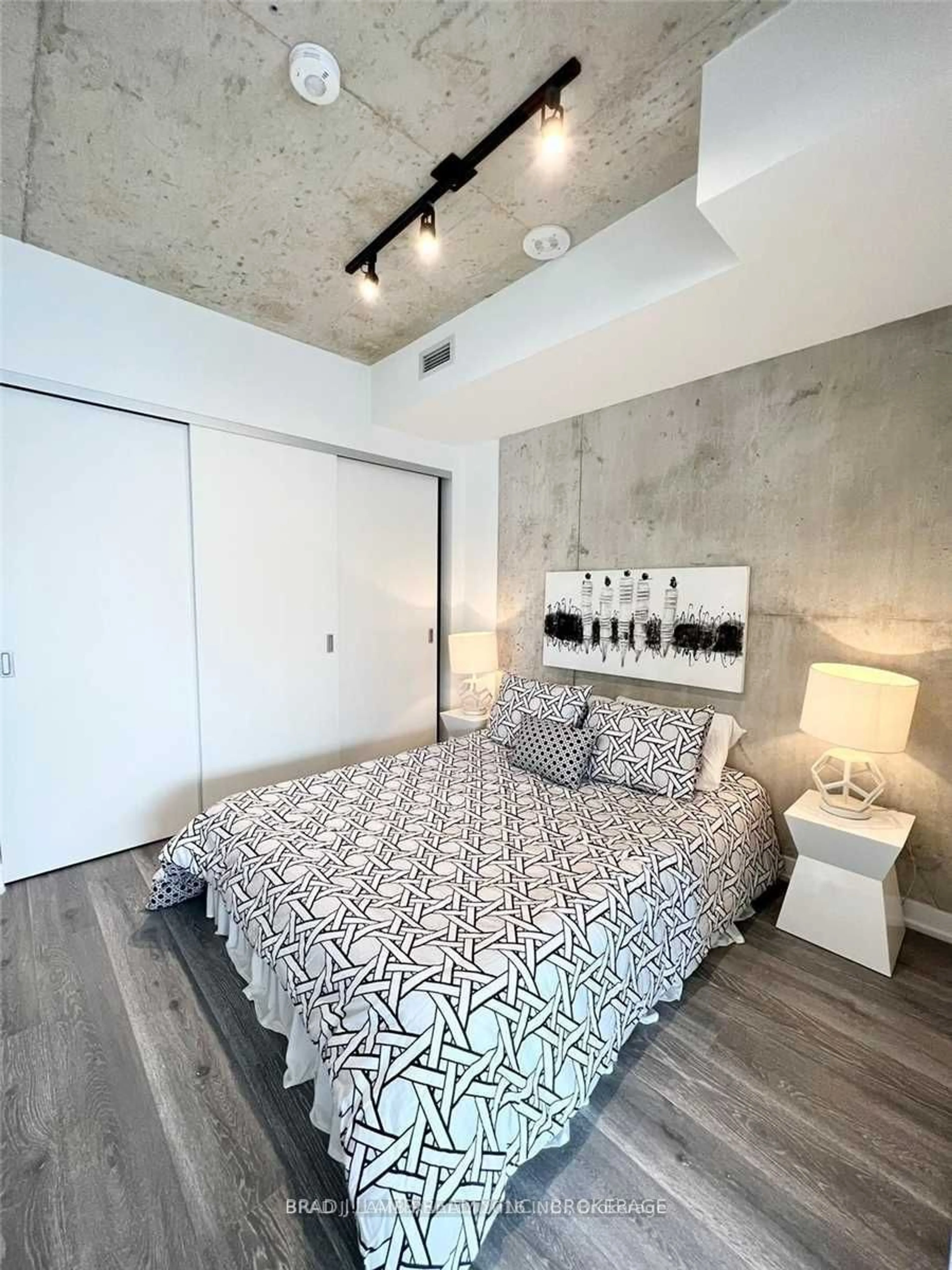 Bedroom with bed, cement floor for 55 Ontario St #813, Toronto Ontario M5A 0T8