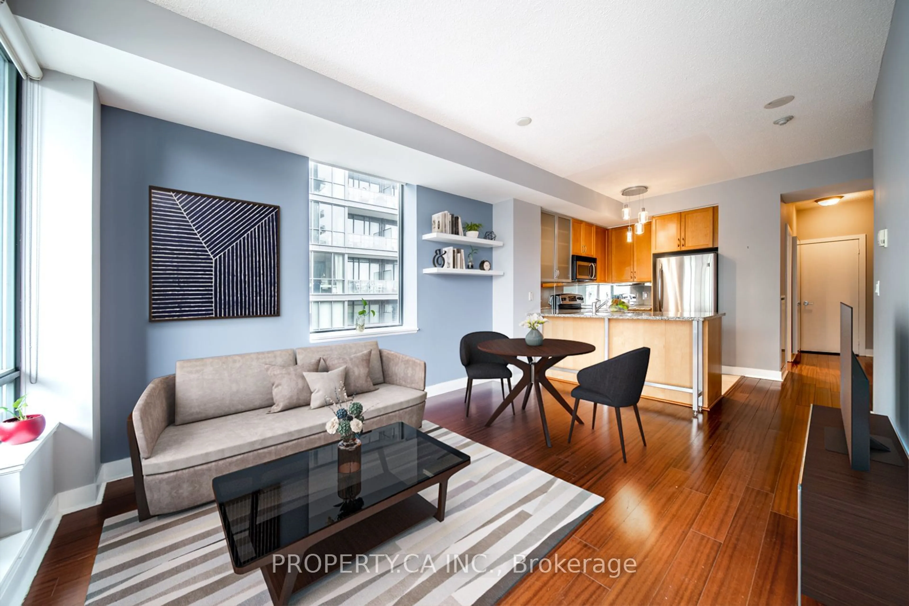 Living room with furniture, wood/laminate floor for 438 King St #1314, Toronto Ontario M5V 3T9