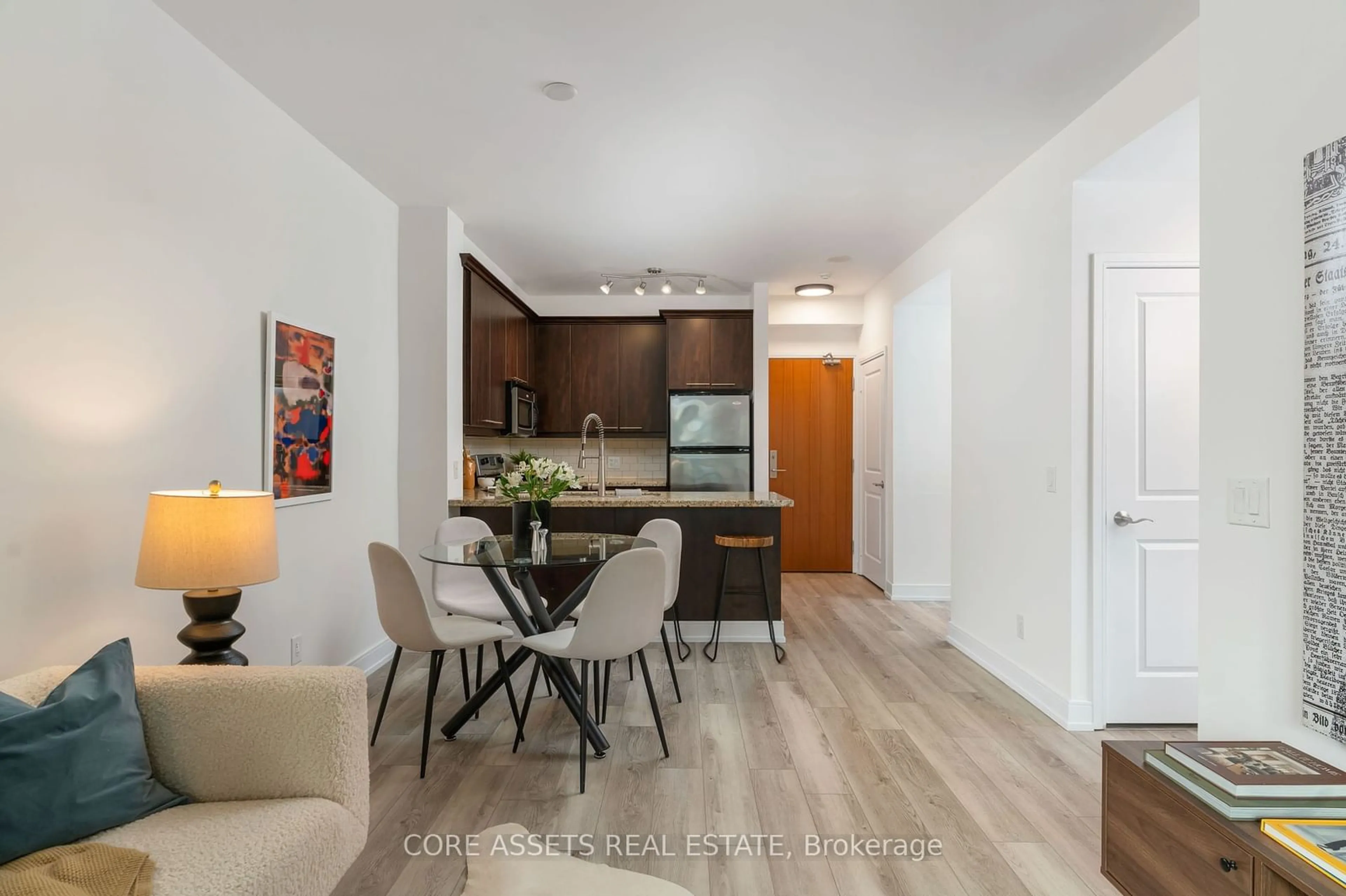 Open concept kitchen, wood/laminate floor for 88 Broadway Ave #1004, Toronto Ontario M4P 0A5