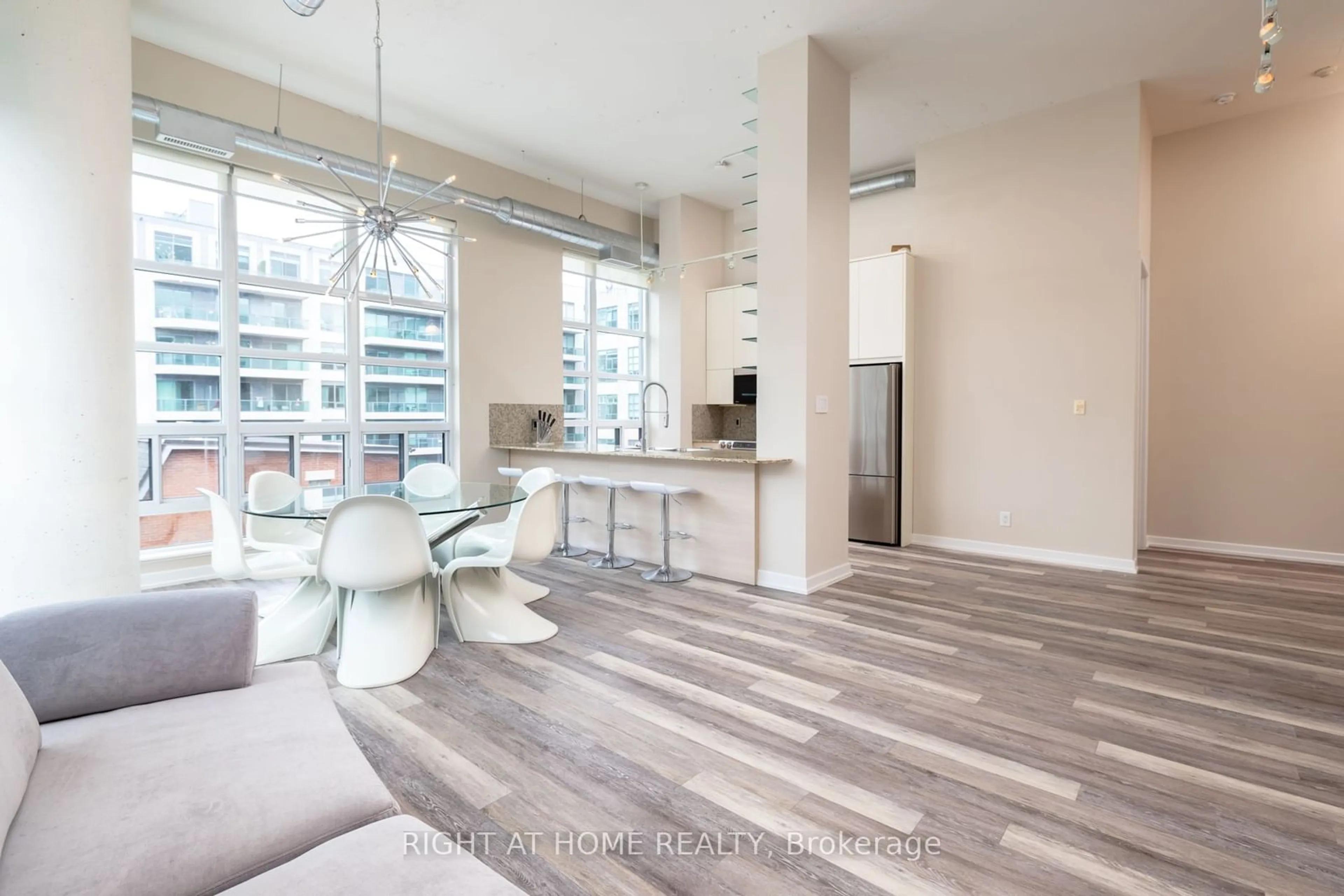 Open concept kitchen, wood/laminate floor for 380 Macpherson Ave #306, Toronto Ontario M4V 3E3