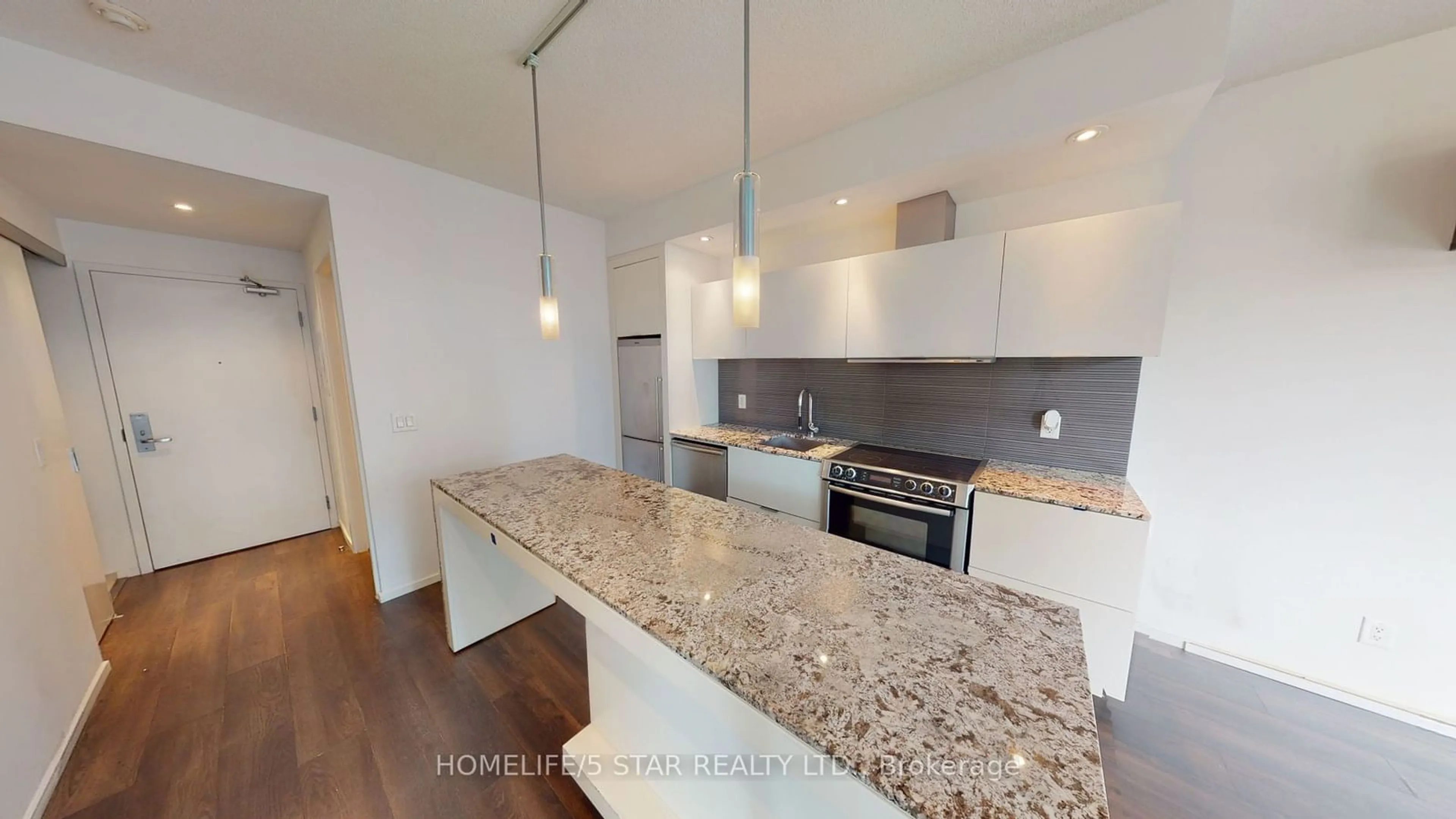 Open concept kitchen, wood/laminate floor for 8 Charlotte St #411, Toronto Ontario M5V 0K4