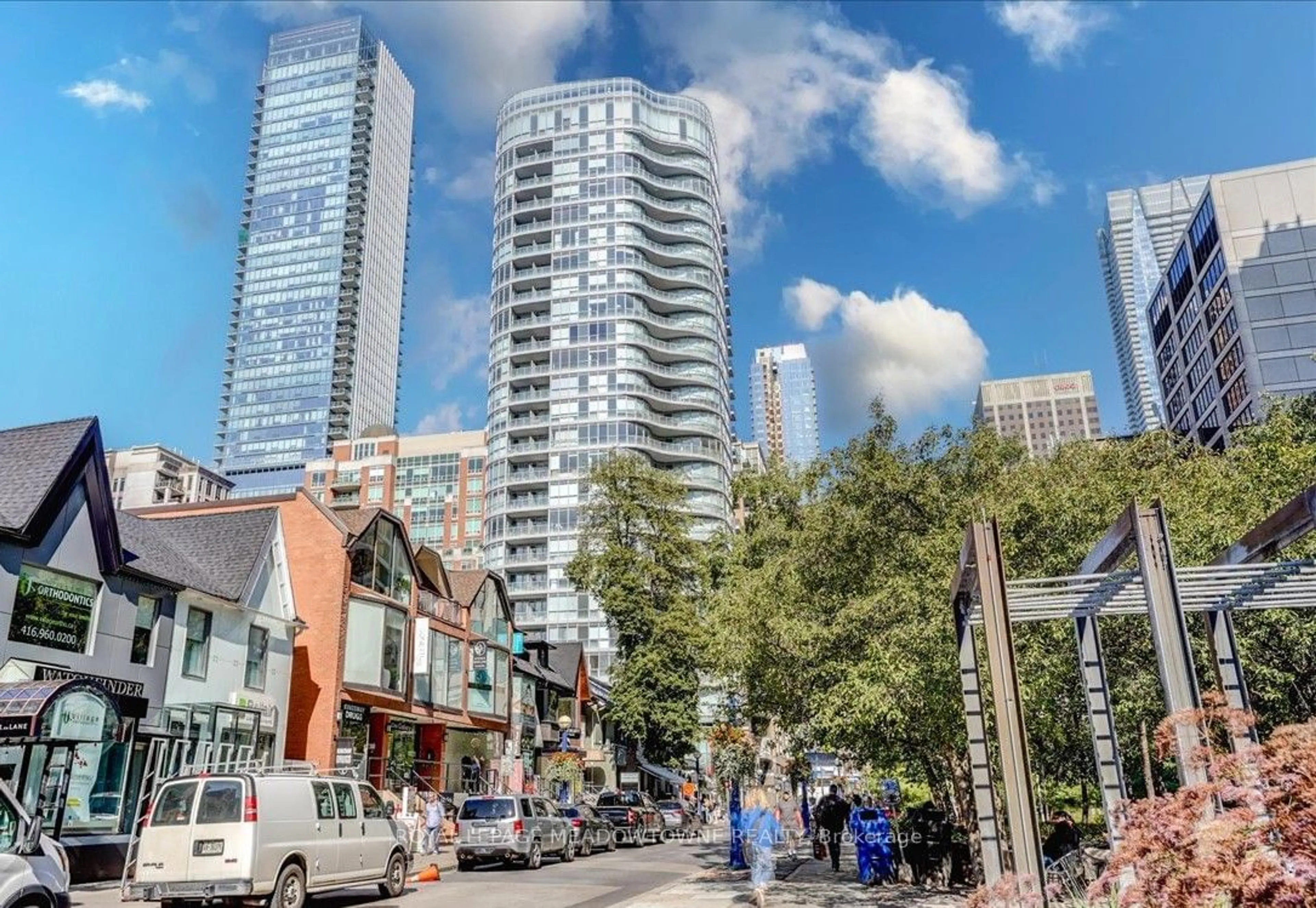 Patio, city buildings view from balcony for 88 Cumberland St #801, Toronto Ontario M5R 0C8