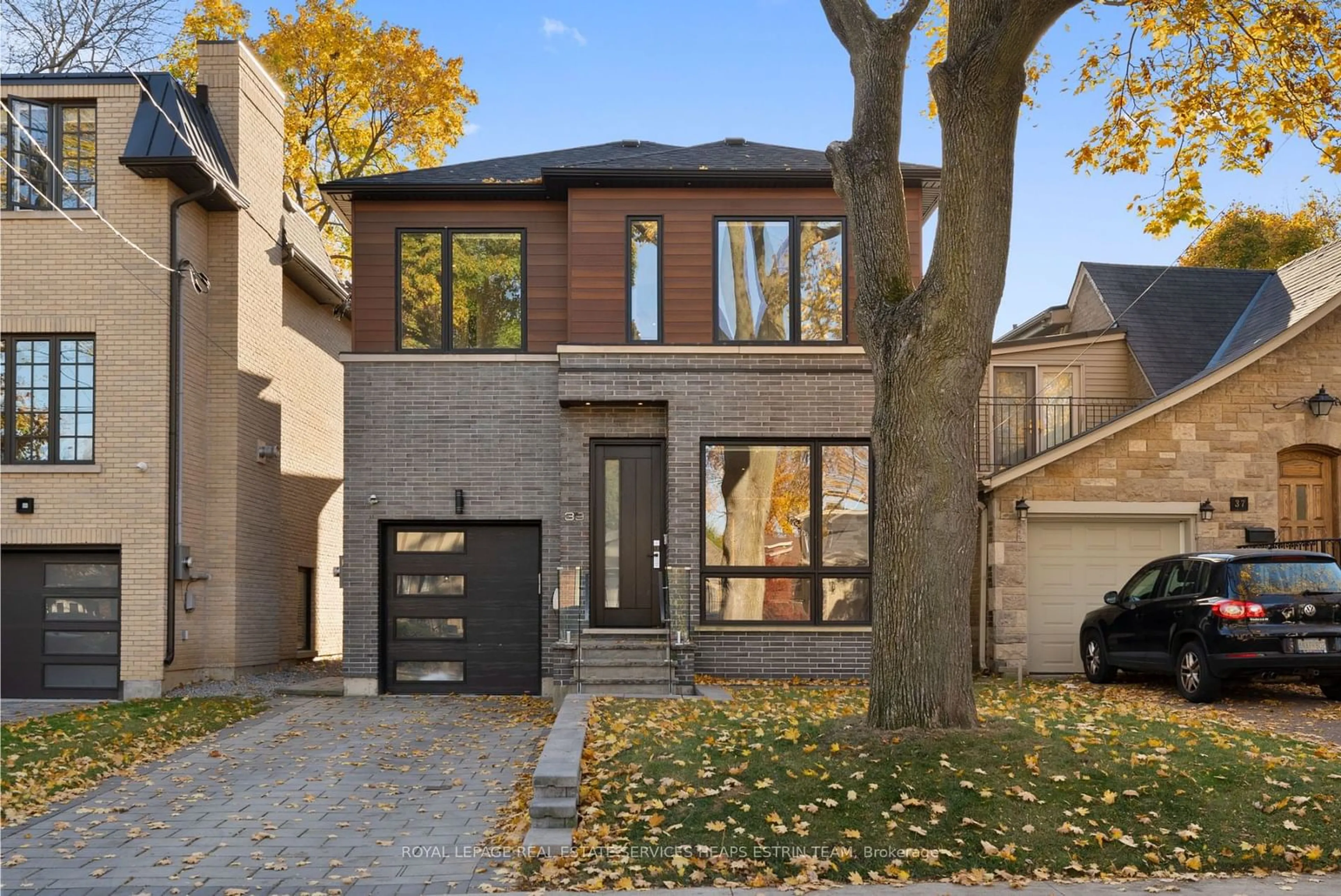 Home with brick exterior material, street for 39 Sharron Dr, Toronto Ontario M4G 2A7