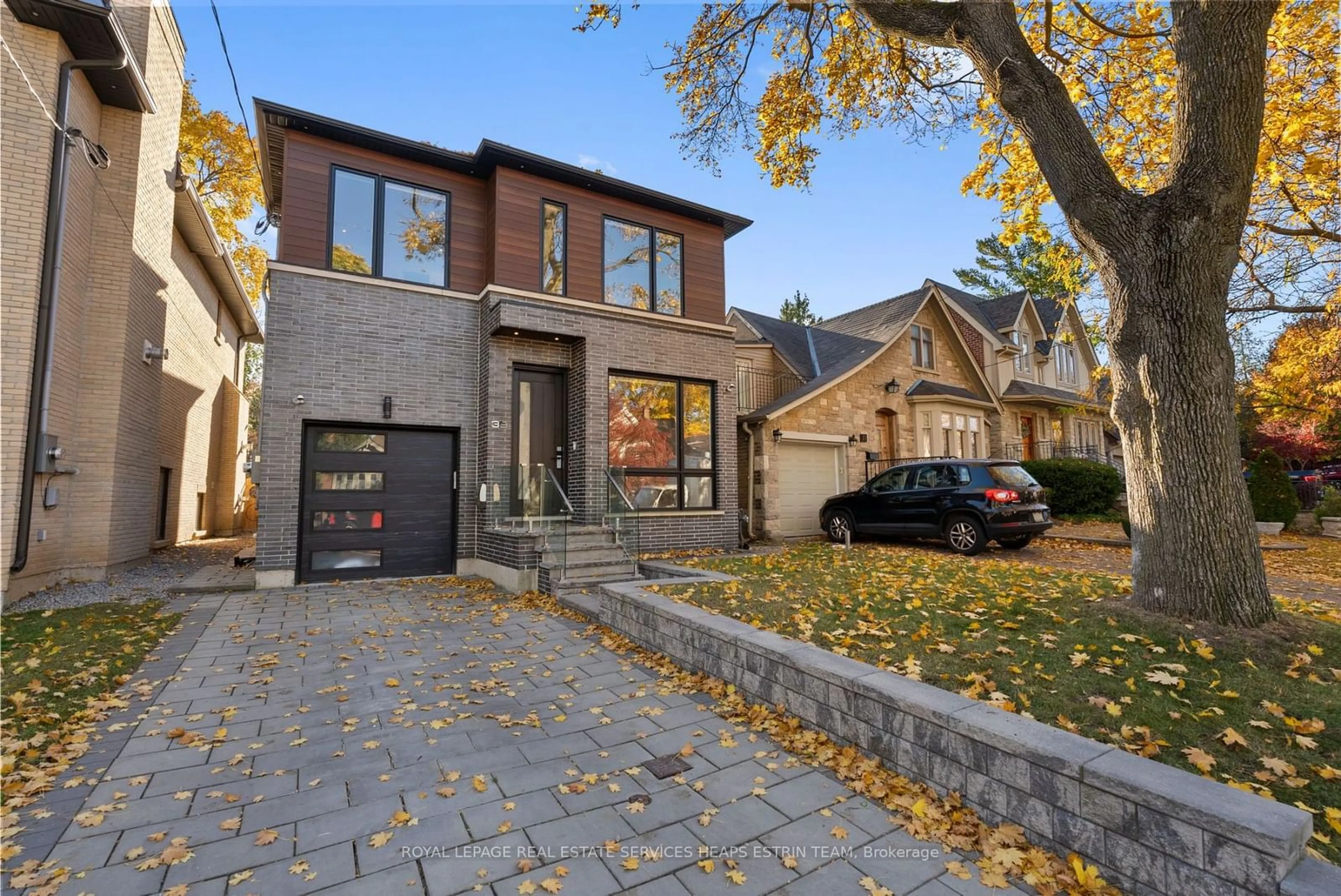 Home with brick exterior material, street for 39 Sharron Dr, Toronto Ontario M4G 2A7