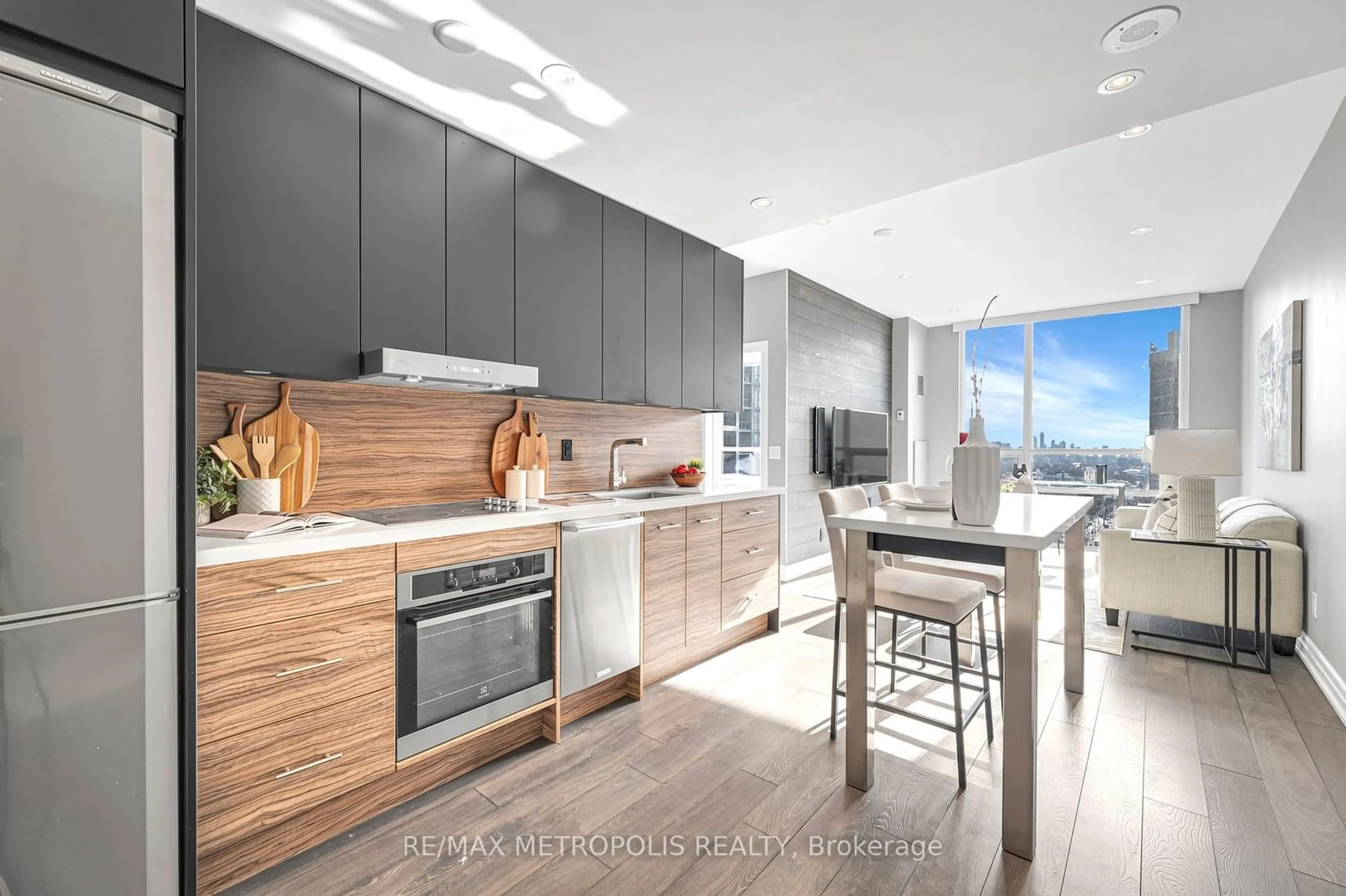 Open concept kitchen, wood/laminate floor for 500 St Clair Ave #1508, Toronto Ontario M6C 1A8