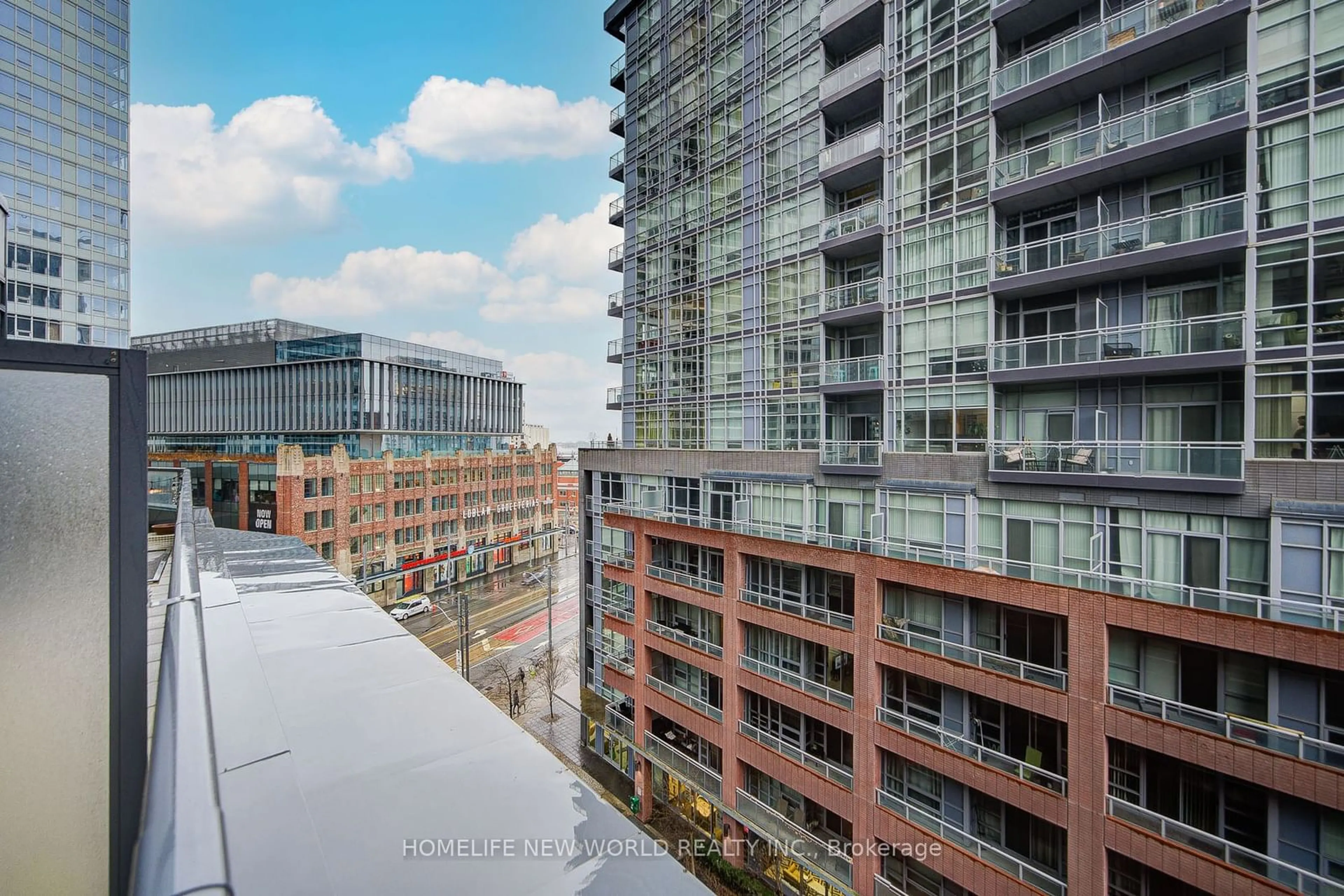 Patio, city buildings view from balcony for 20 Bruyeres Mews #708, Toronto Ontario M5V 0G8