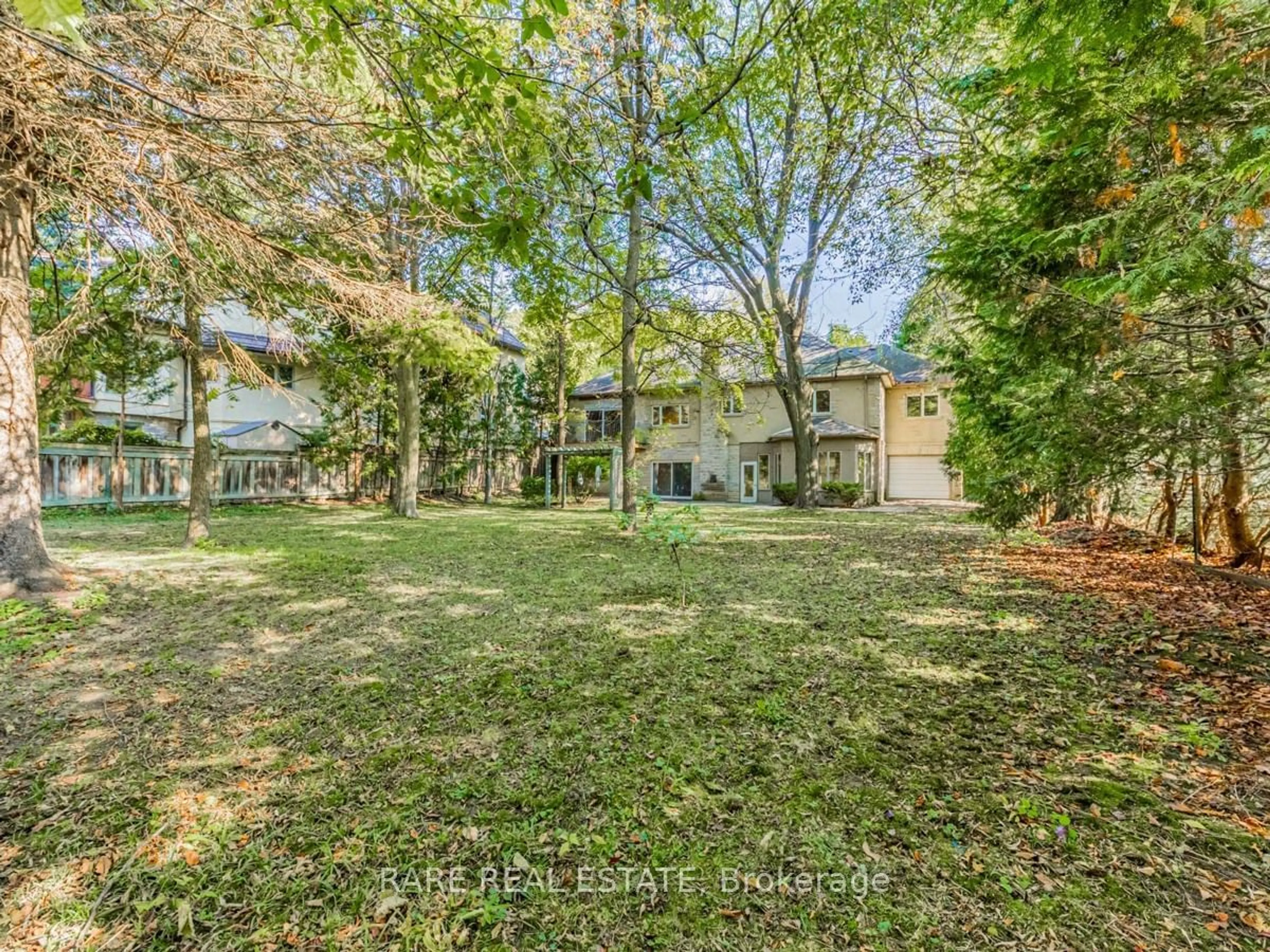 A pic from outside/outdoor area/front of a property/back of a property/a pic from drone, forest/trees view for 70 Don River Blvd, Toronto Ontario M2N 2M9