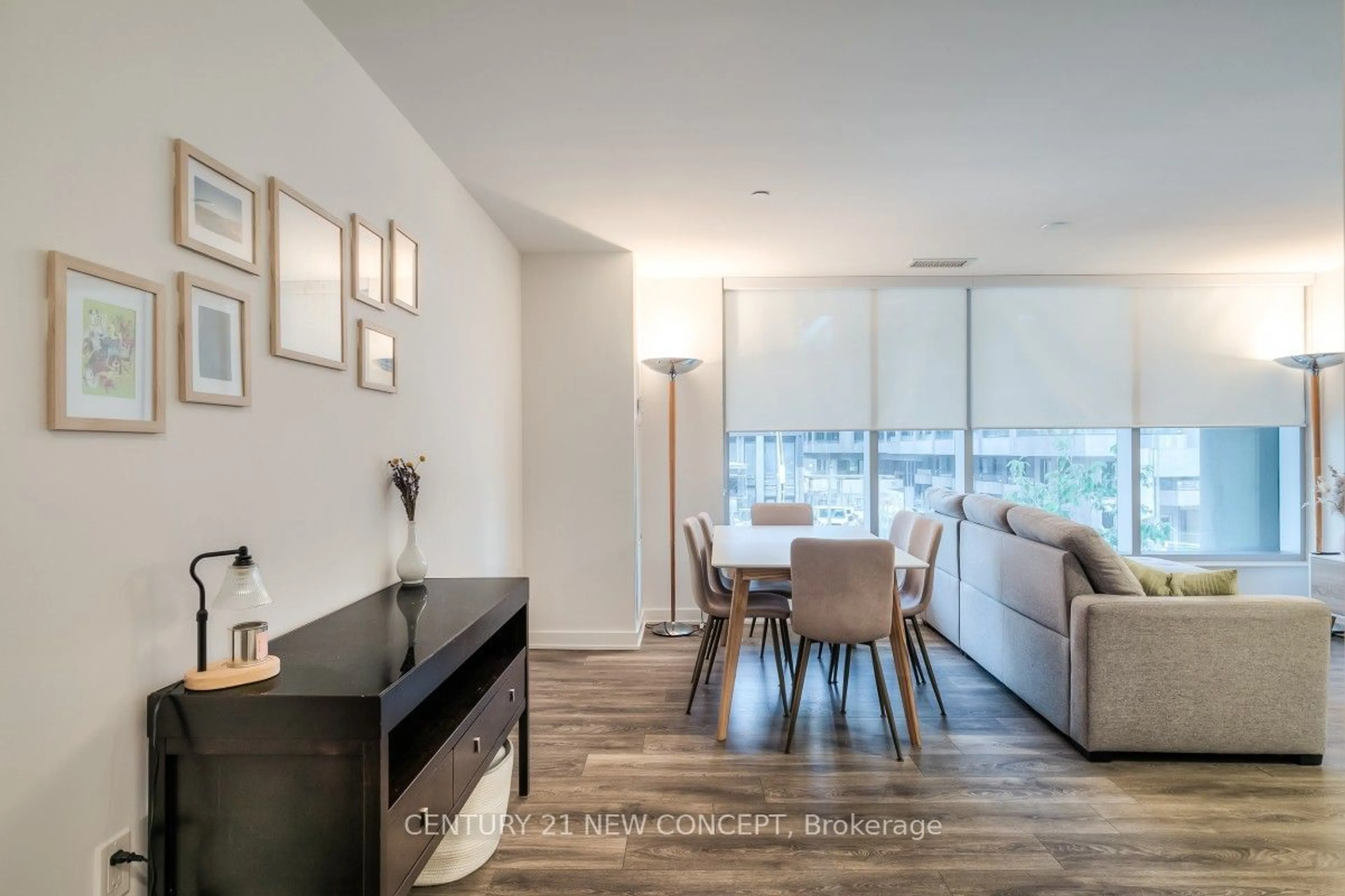 Living room with furniture, wood/laminate floor for 99 Broadway Ave #210, Toronto Ontario M4P 0E3