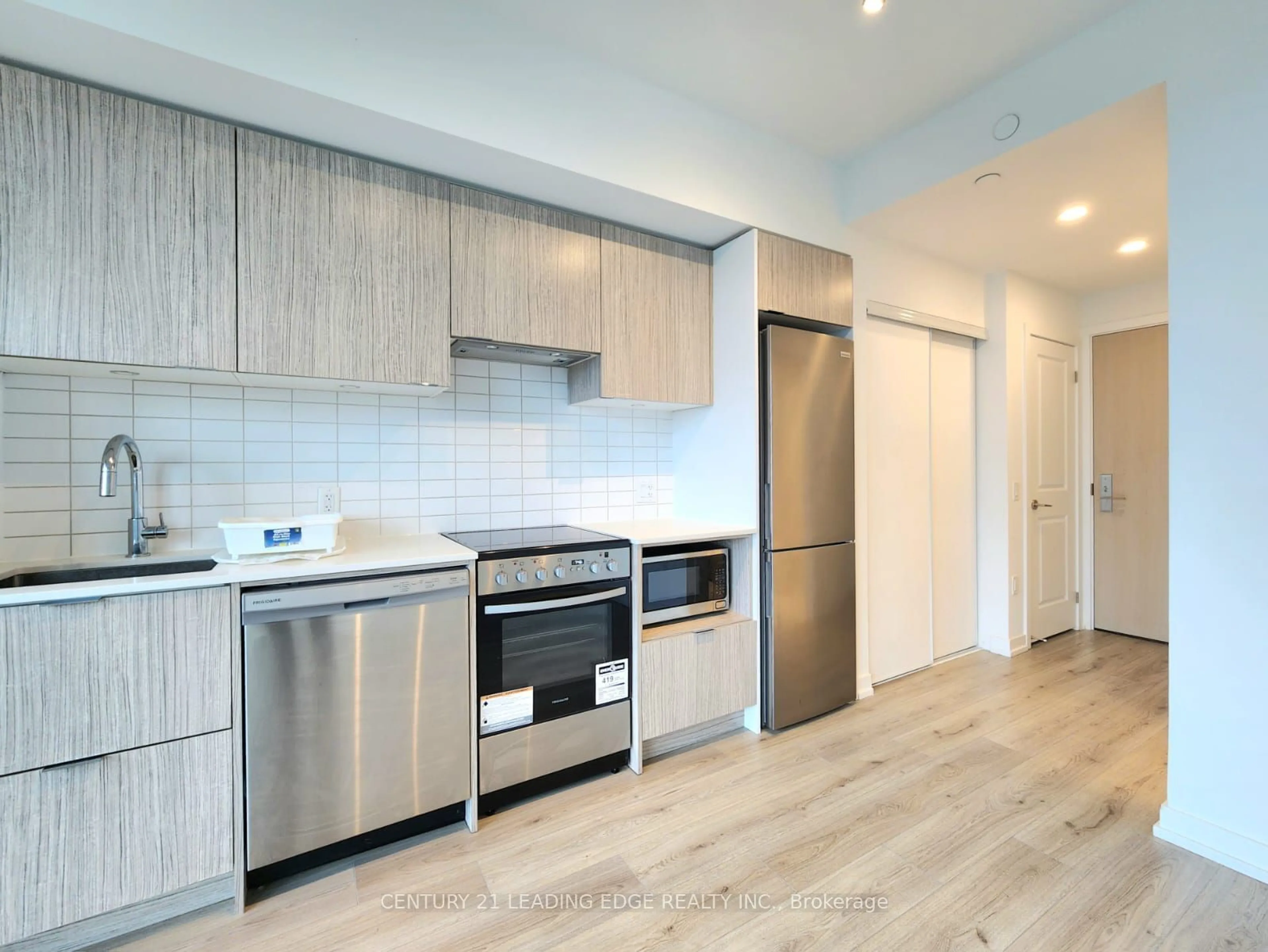 Open concept kitchen, wood/laminate floor for 395 Bloor St #4708, Toronto Ontario M4W 1H7