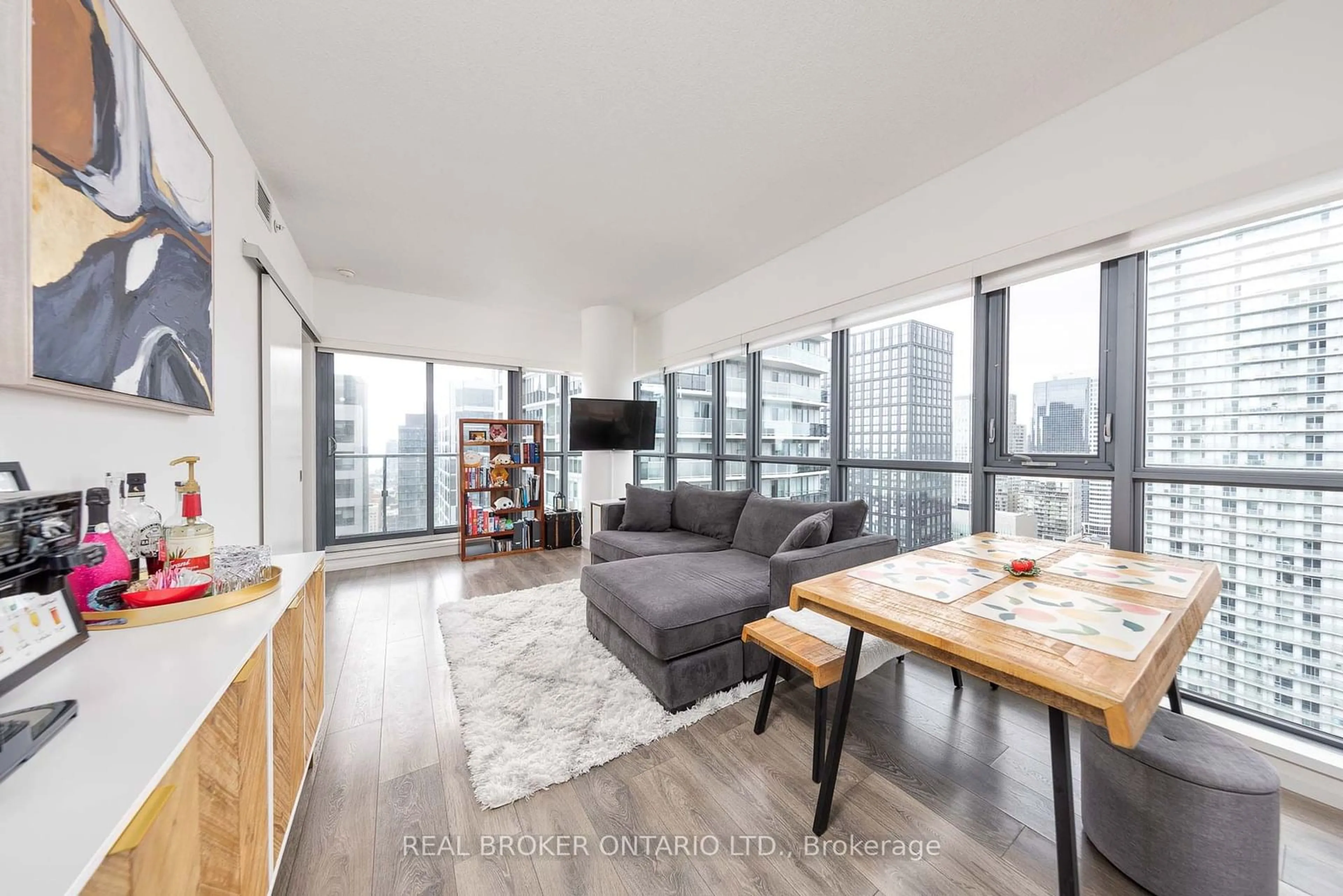 Living room with furniture, wood/laminate floor for 159 Dundas St #2901, Toronto Ontario M5B 0A9