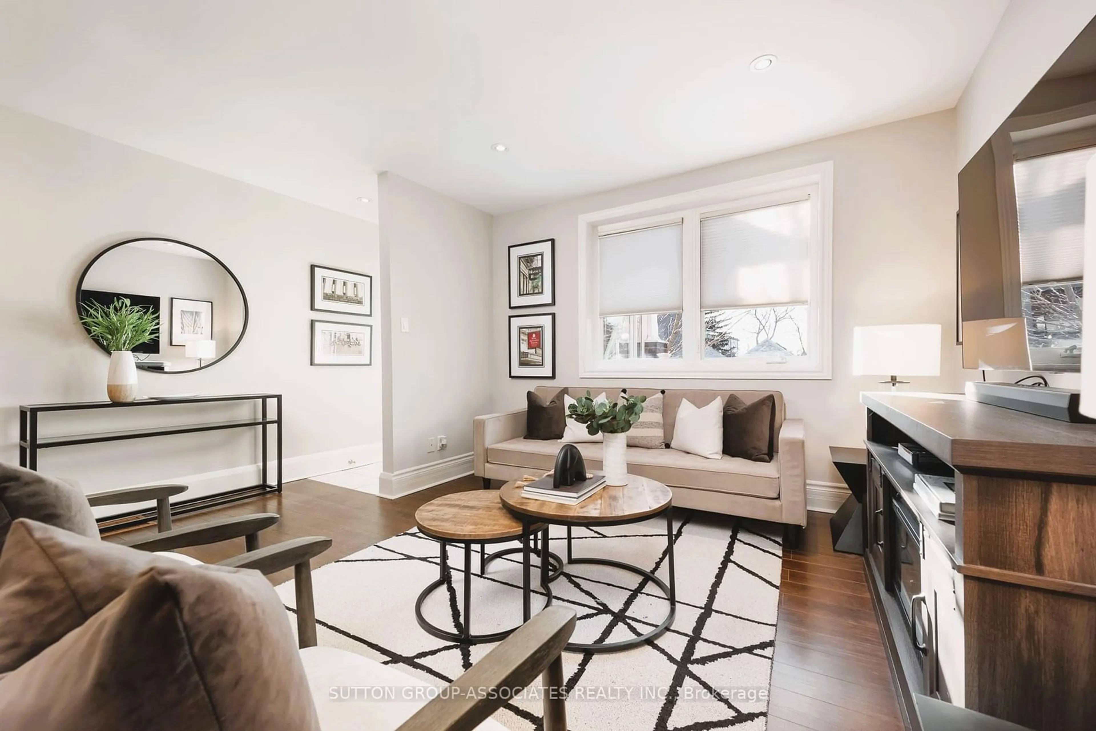 Living room with furniture, wood/laminate floor for 179 Cedric Ave, Toronto Ontario M6C 3X7