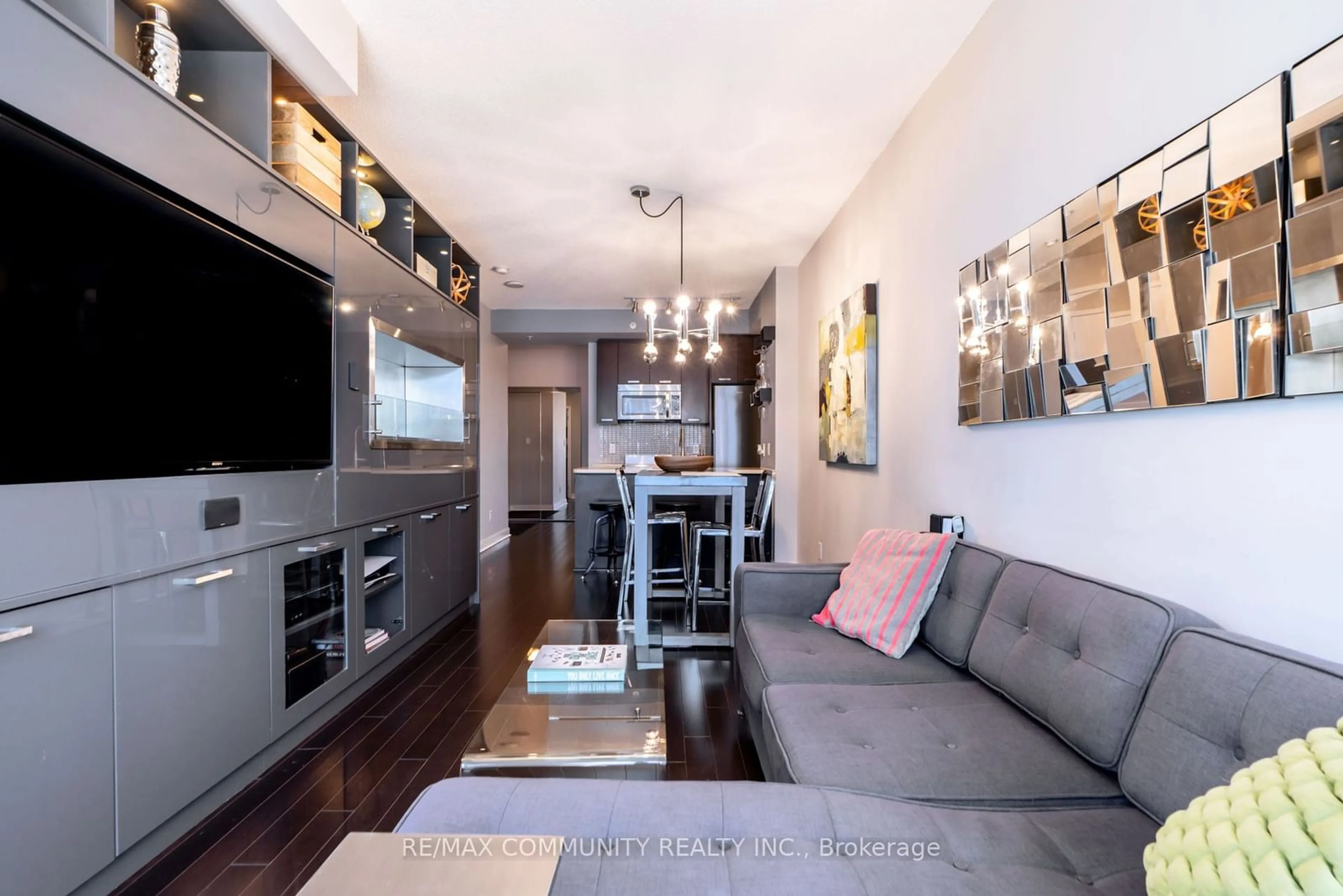 Living room with furniture, wood/laminate floor for 295 Adelaide St #2406, Toronto Ontario M5V 0L4