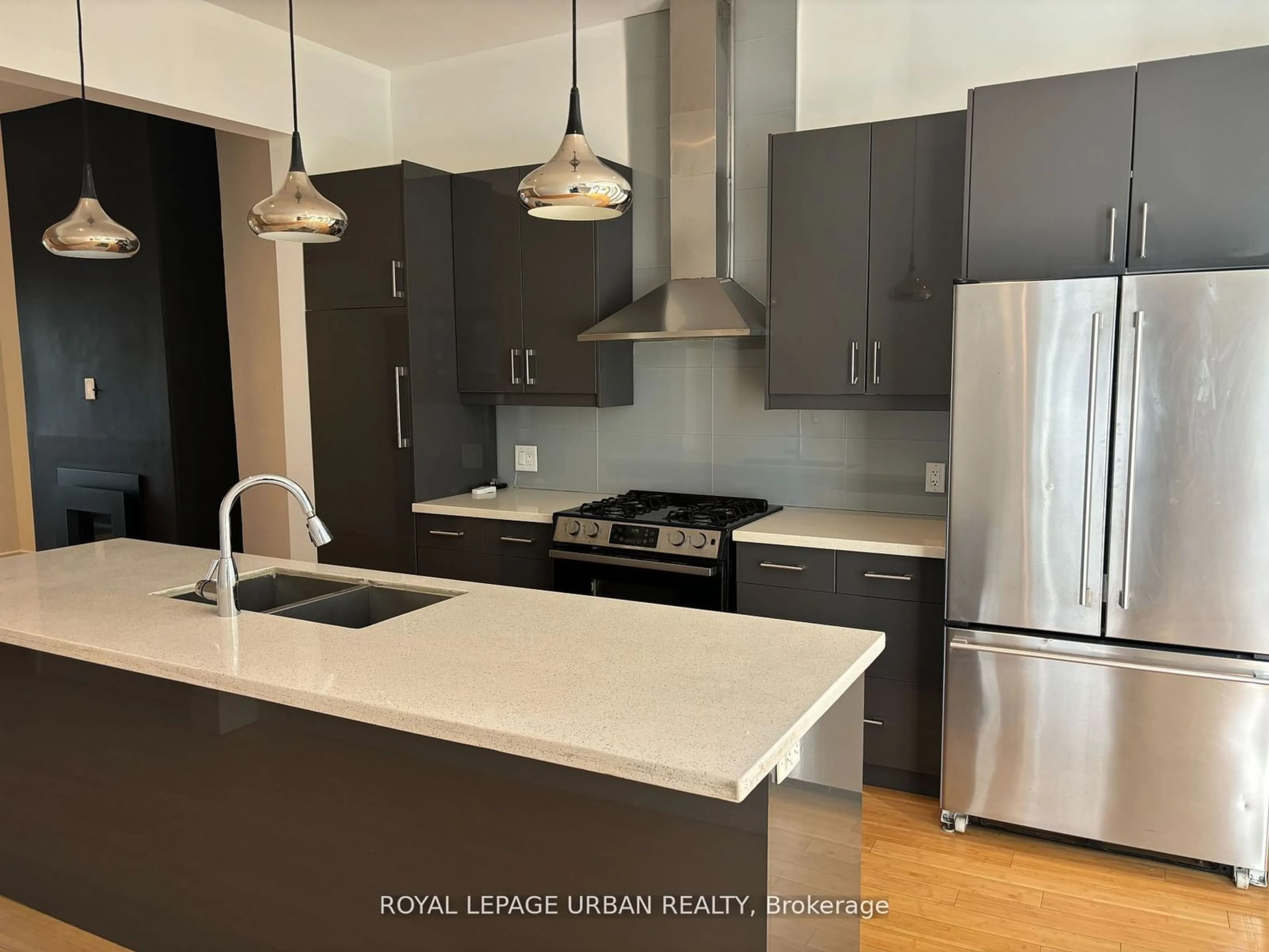 Open concept kitchen, wood/laminate floor for 323 Ontario St, Toronto Ontario M5A 2V8