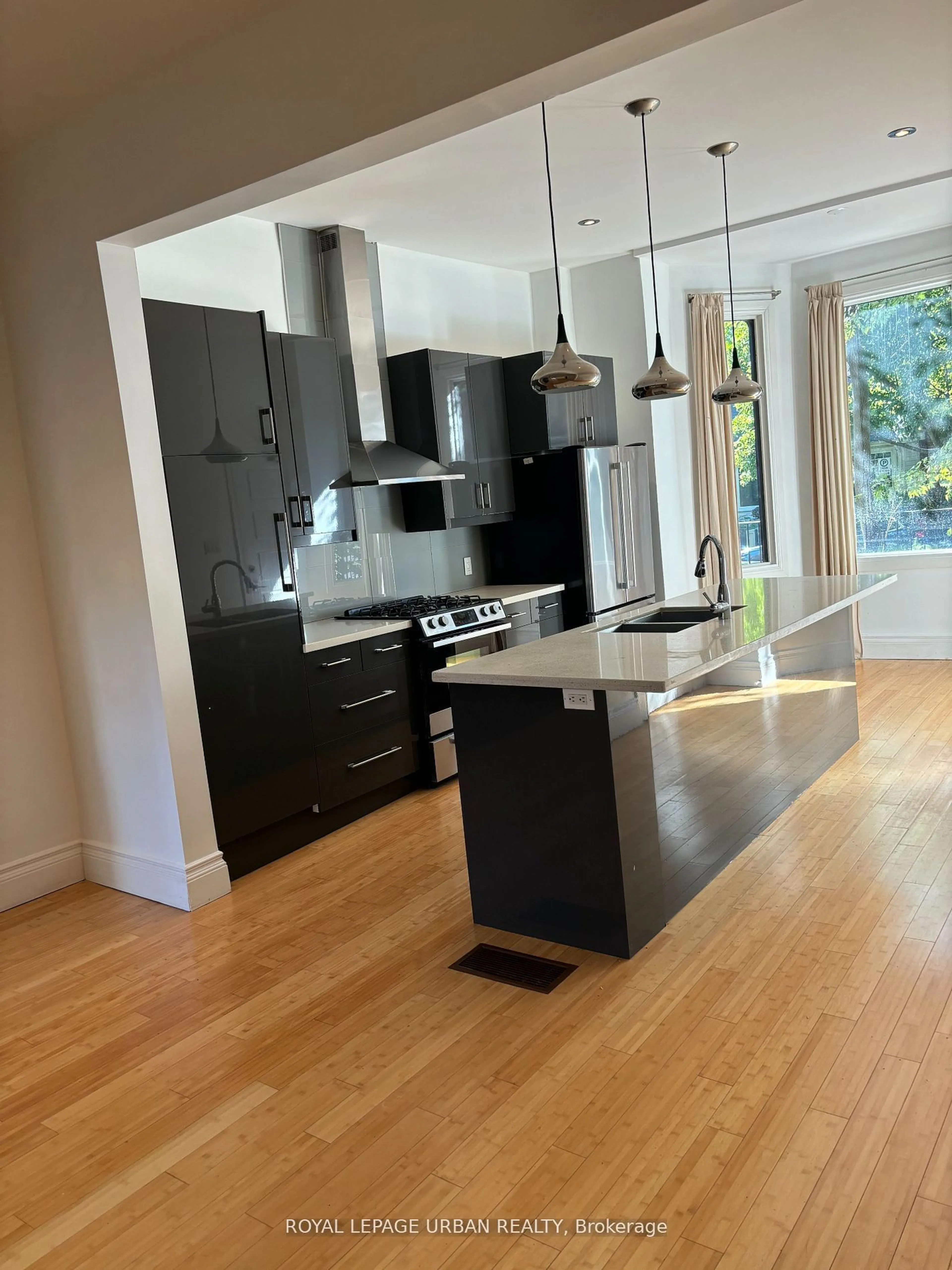 Contemporary kitchen, wood/laminate floor for 323 Ontario St, Toronto Ontario M5A 2V8