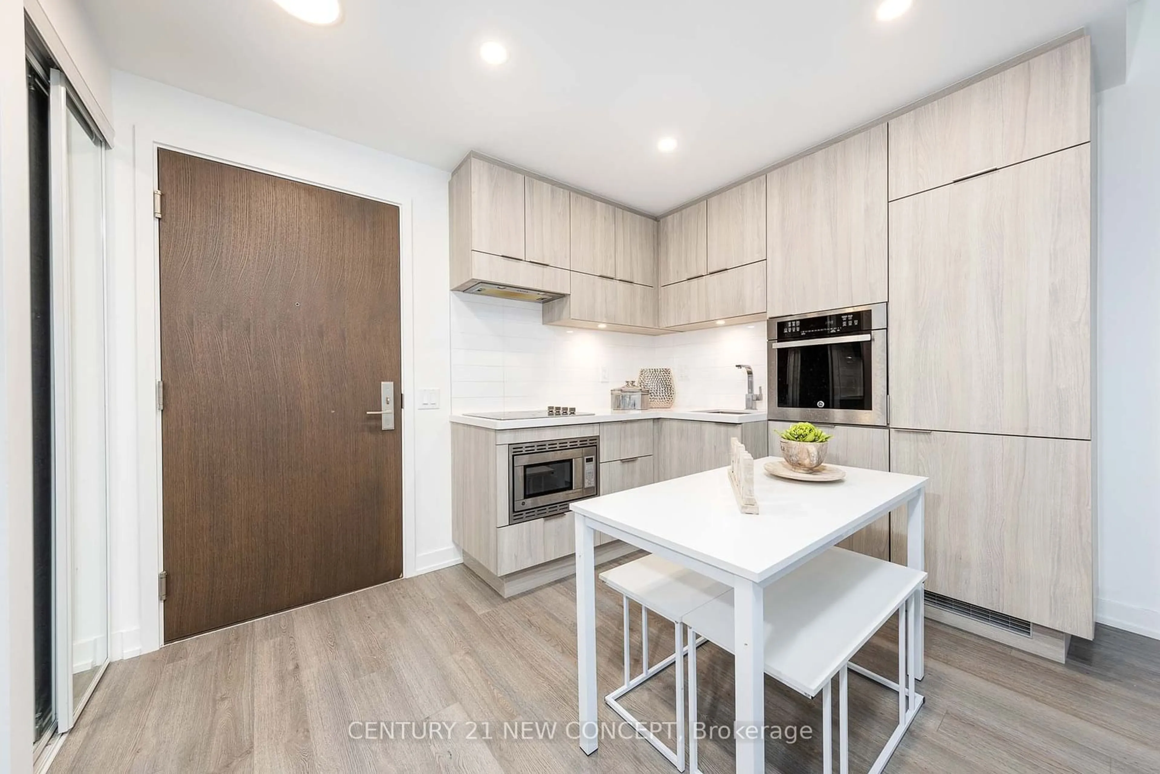 Open concept kitchen, wood/laminate floor for 39 Roehampton Ave #2007, Toronto Ontario M4P 1P9