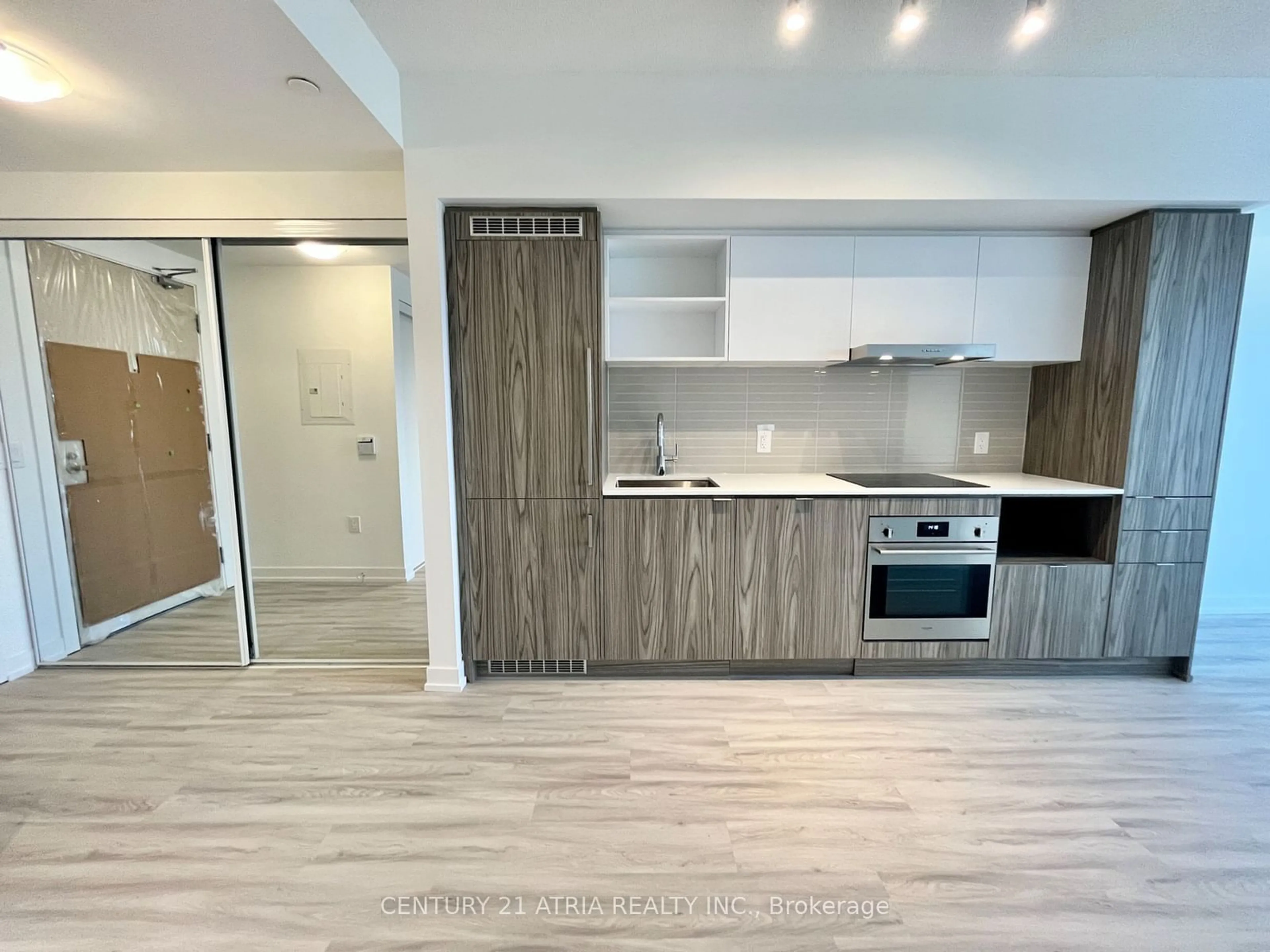 Open concept kitchen, wood/laminate floor for 55 Cooper St #3102, Toronto Ontario M5E 0G1