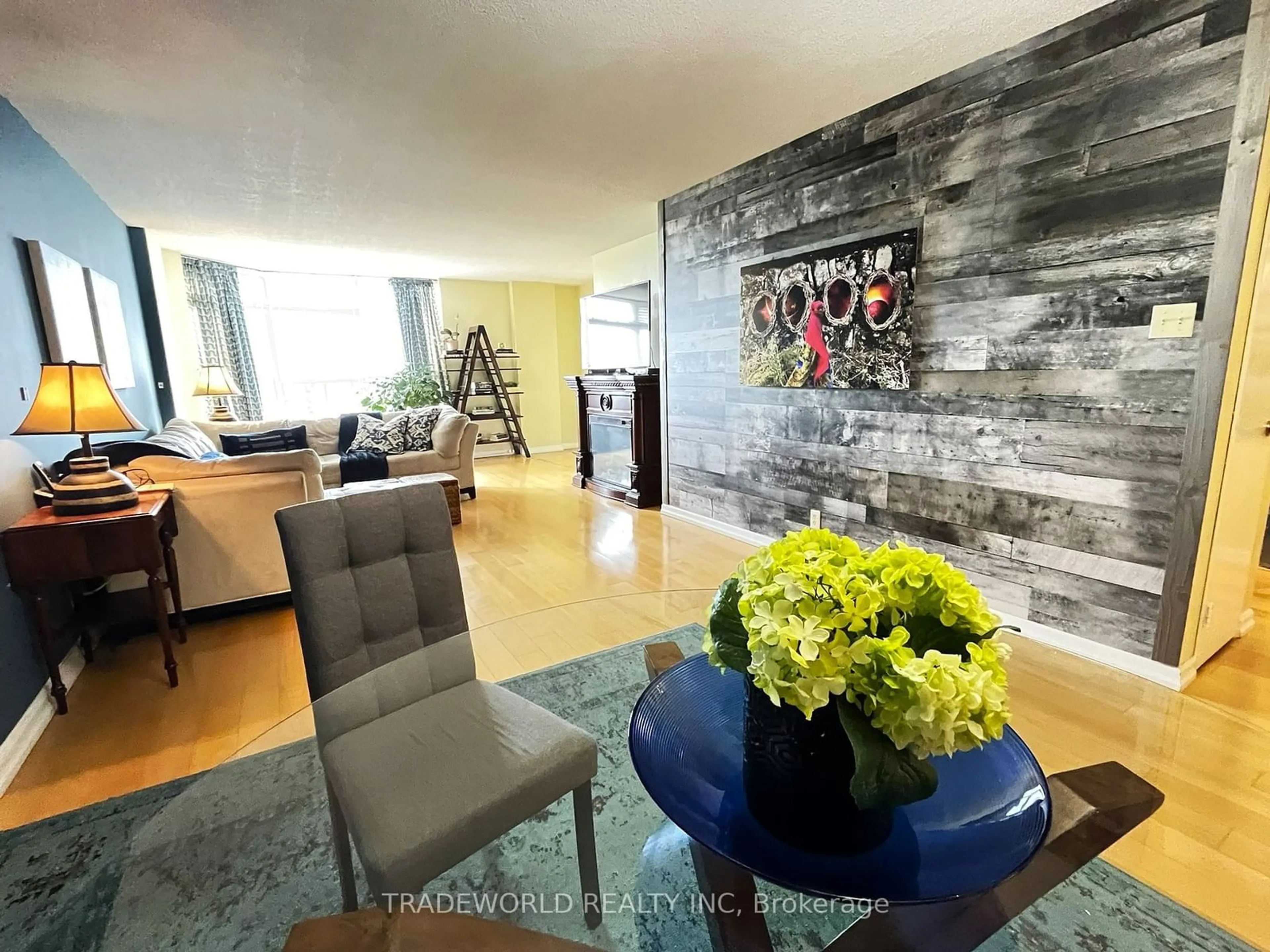 Living room with furniture, wood/laminate floor for 215 Wynford Dr #2307, Toronto Ontario M3C 3P5