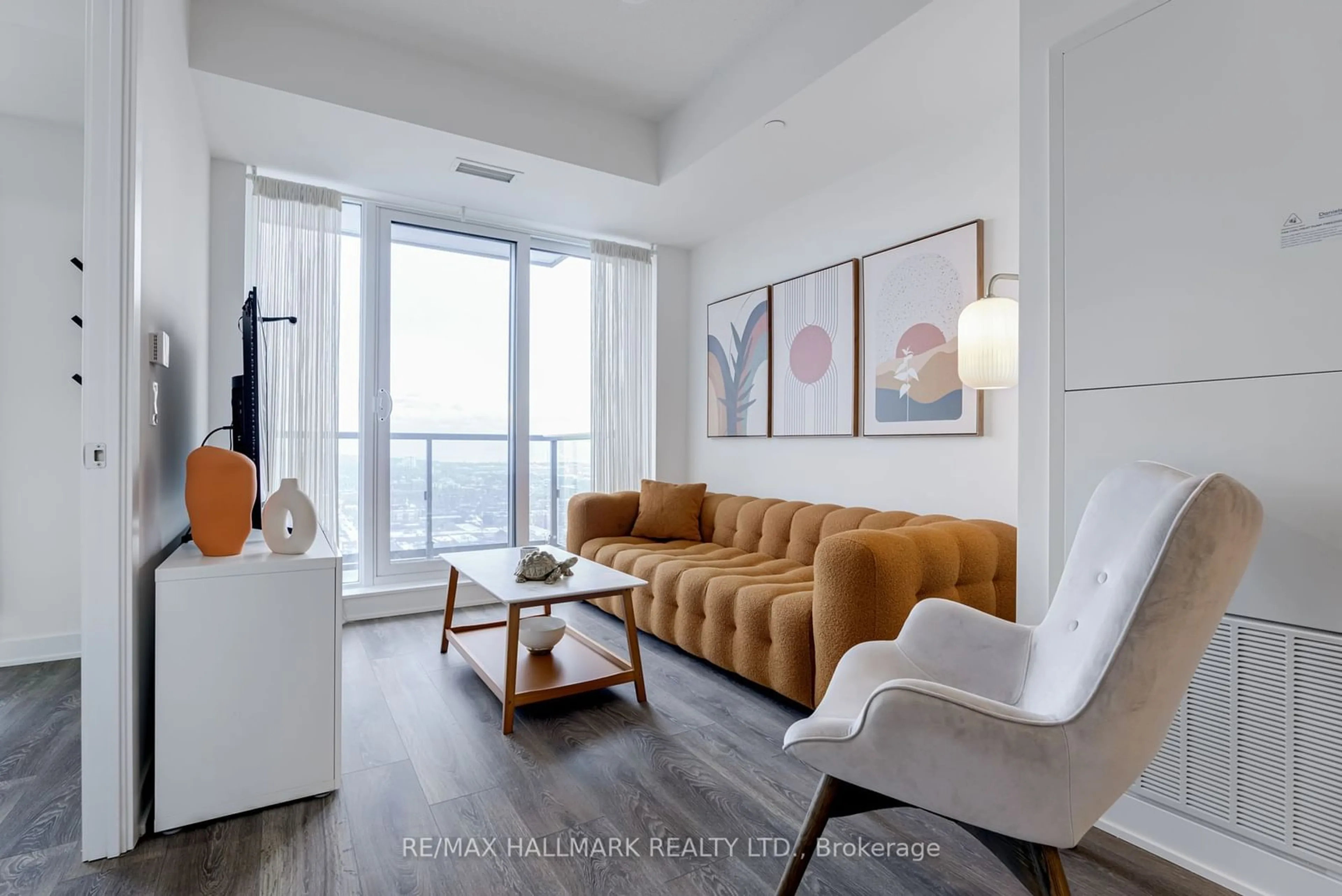 Living room with furniture, wood/laminate floor for 130 River St #3012, Toronto Ontario M5A 0R8