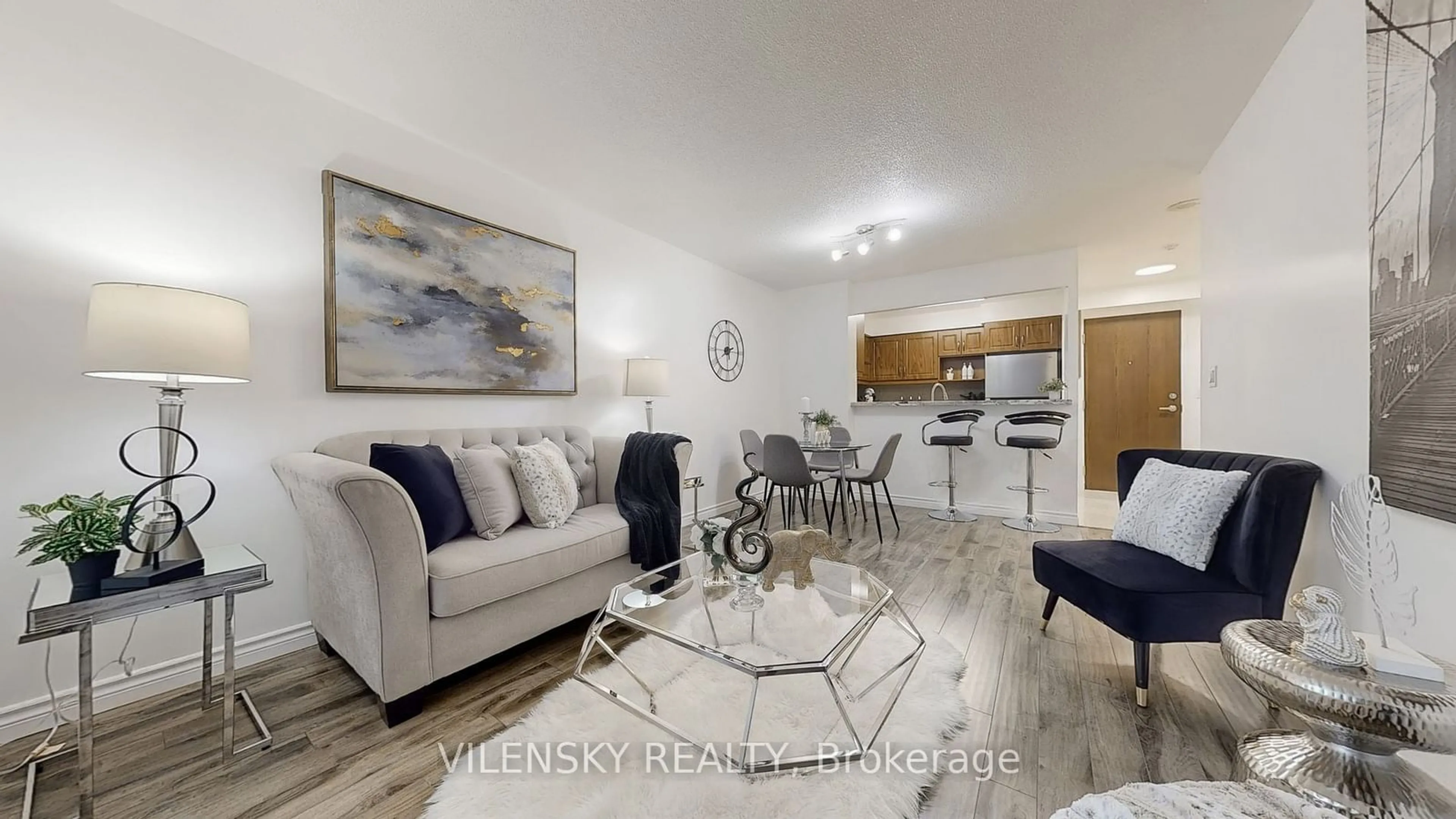 Living room with furniture, wood/laminate floor for 29 Pemberton Ave #207, Toronto Ontario M2M 4L5