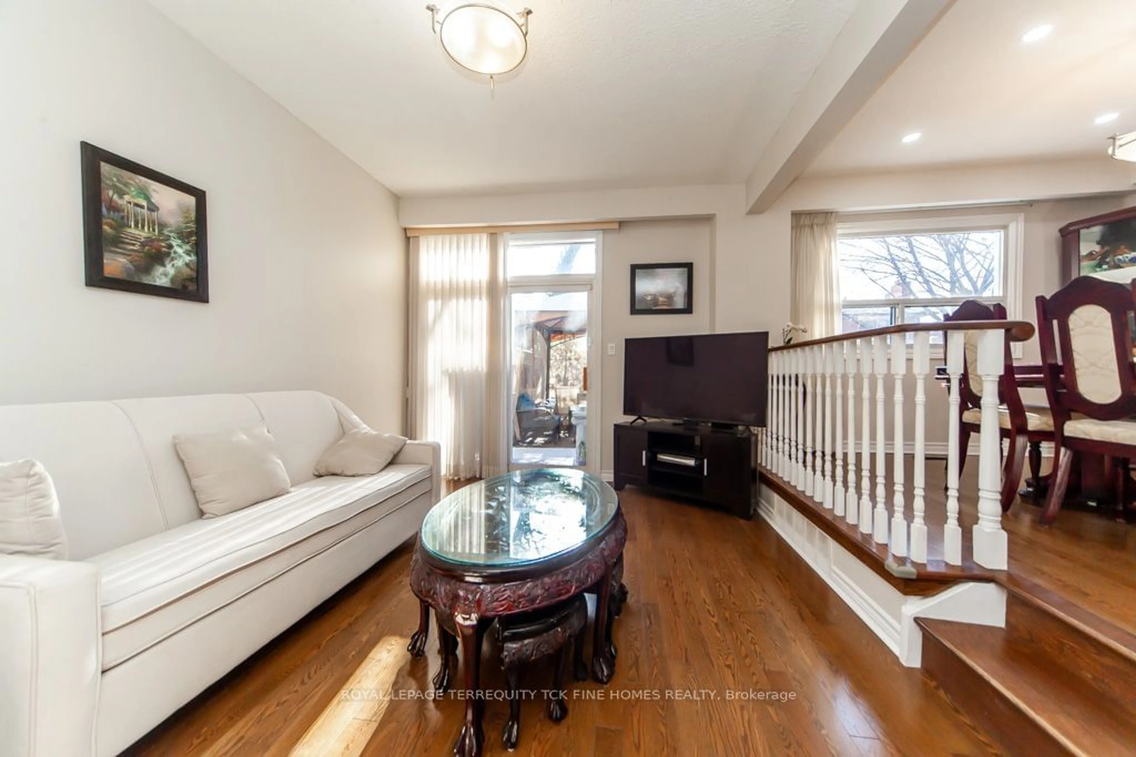 Living room with furniture, wood/laminate floor for 79 Black Hawk Way, Toronto Ontario M2R 3L7