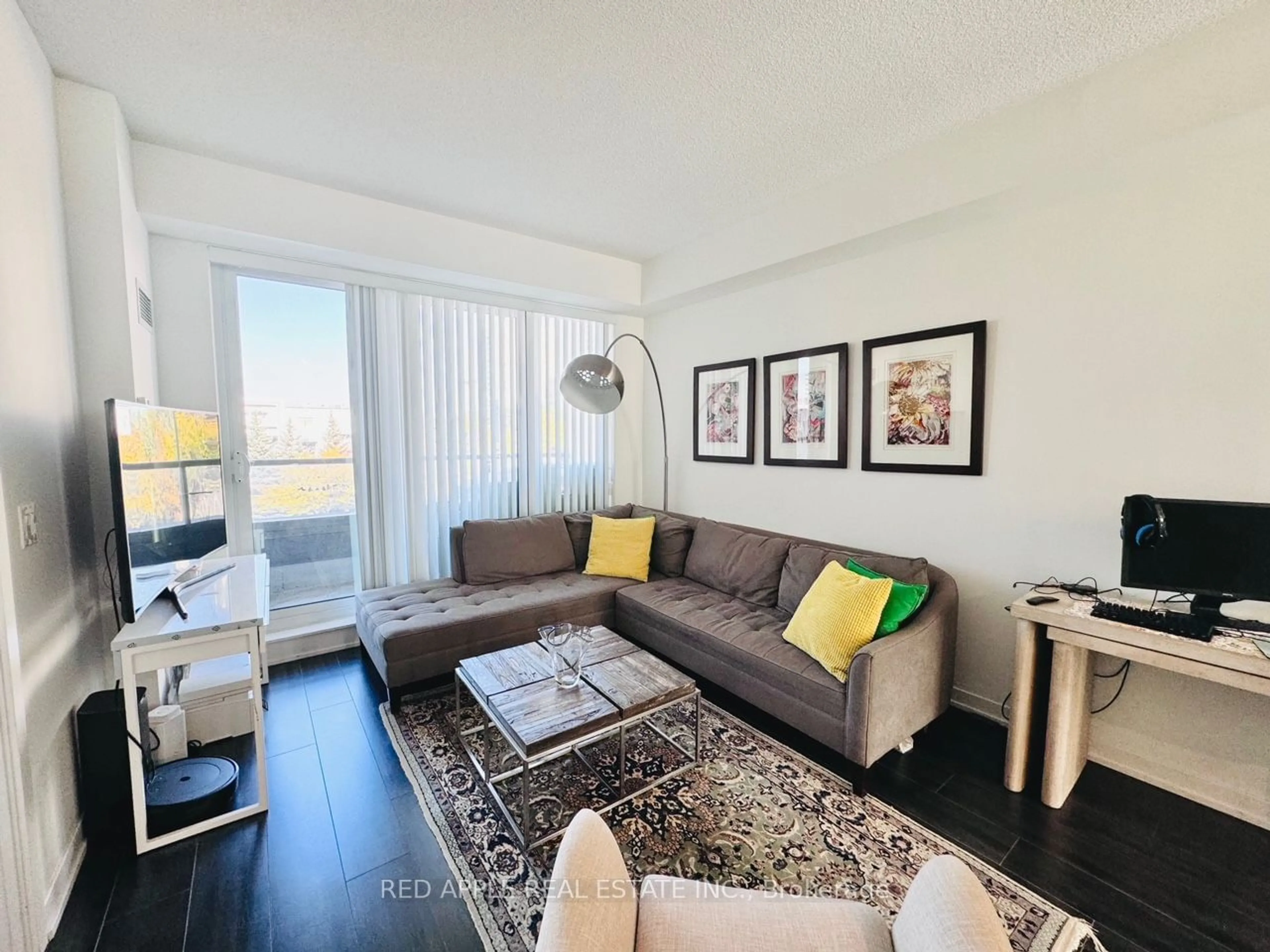 Living room with furniture, wood/laminate floor for 18 Rean Dr #306, Toronto Ontario M2K 0C7