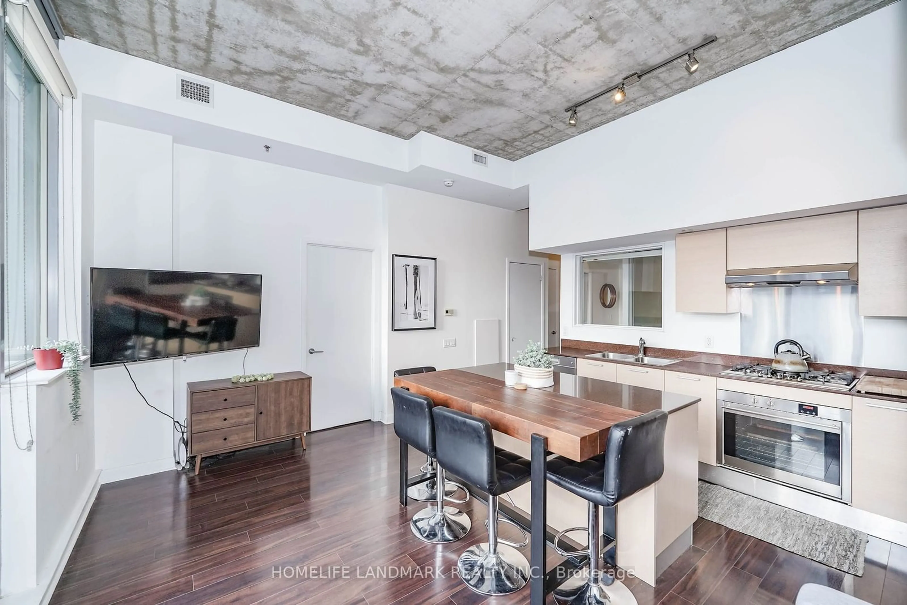 Open concept kitchen, cement floor for 375 King St #1603, Toronto Ontario M5V 1K1