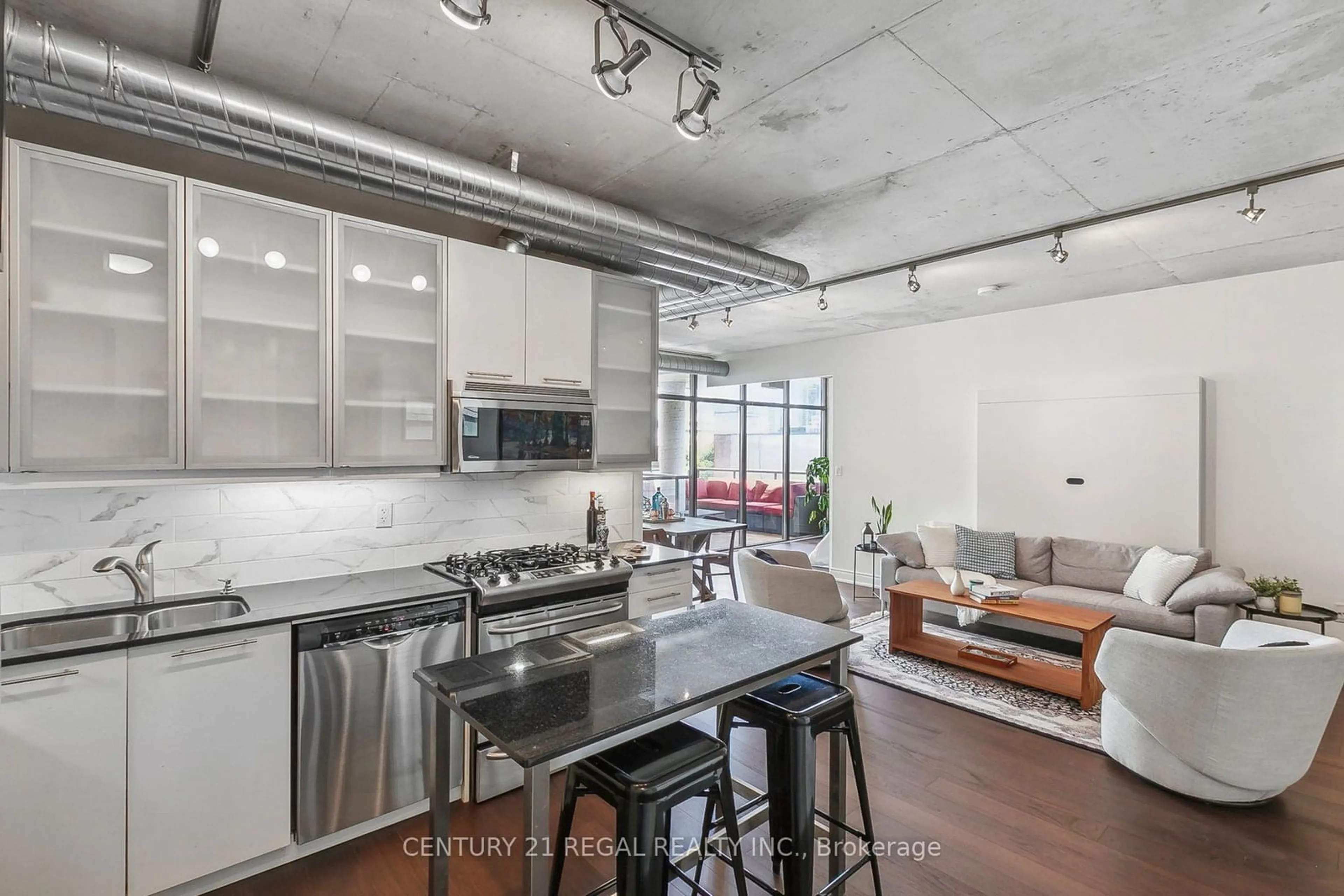 Open concept kitchen, cement floor for 533 Richmond St #605, Toronto Ontario M5V 3Y1