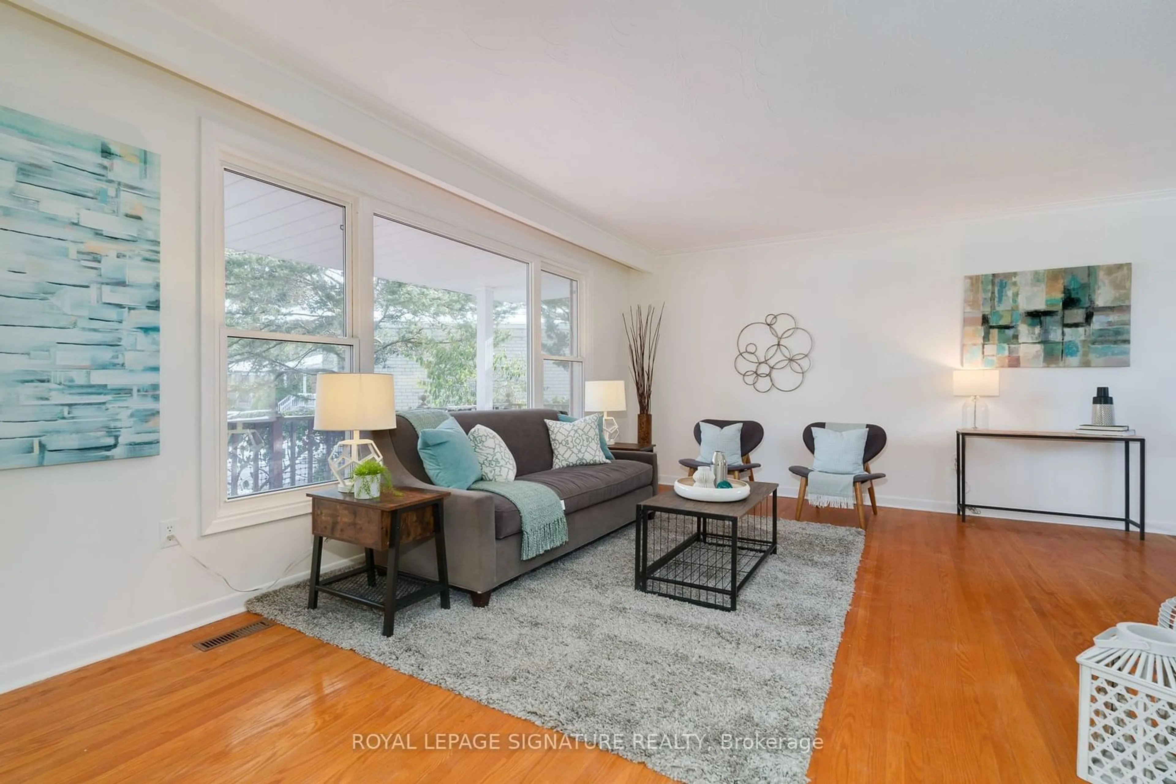 Living room with furniture, wood/laminate floor for 16 Lesgay Cres, Toronto Ontario M2J 2H8