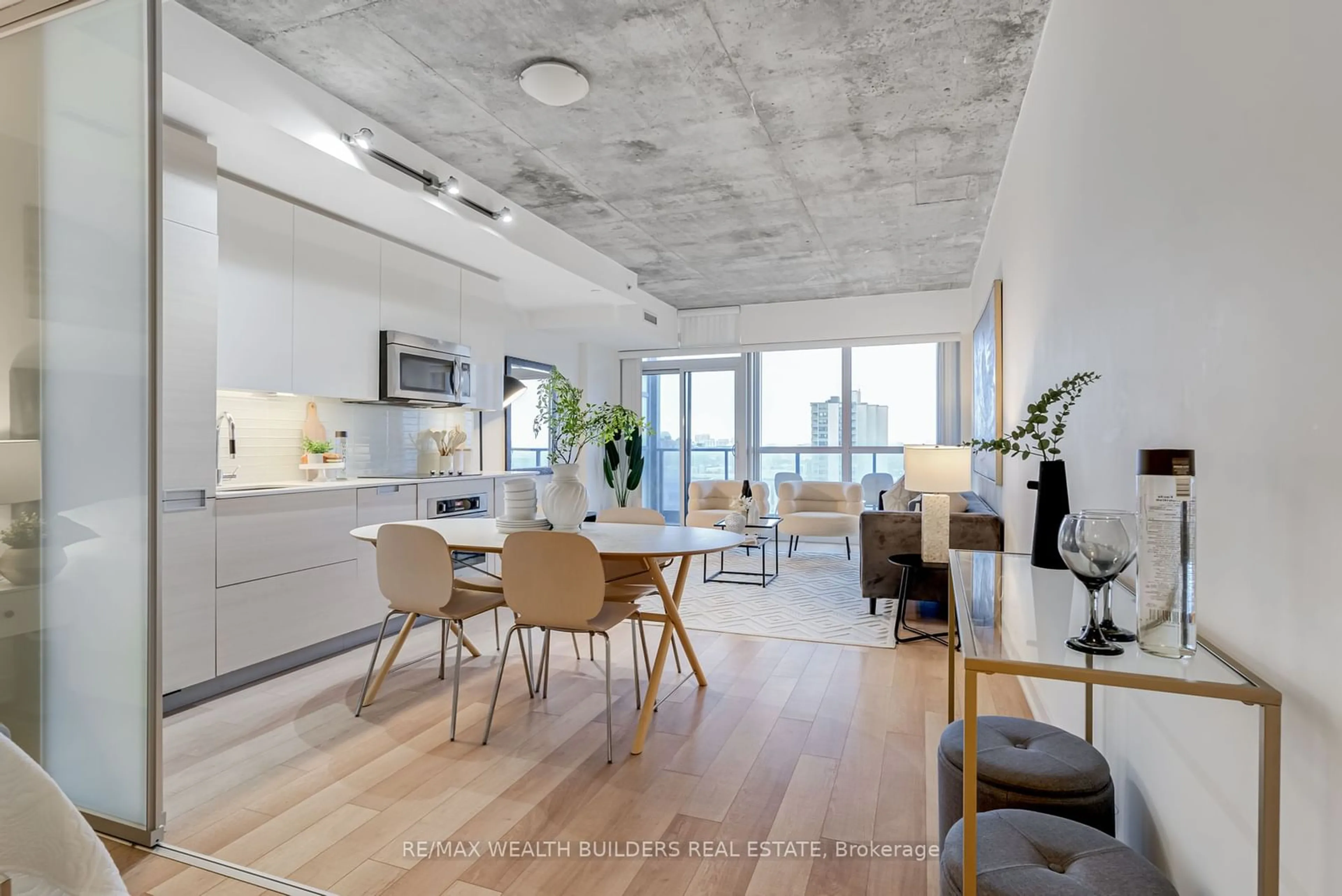 Open concept kitchen, cement floor for 210 Simcoe St #1706, Toronto Ontario M5T 1T4