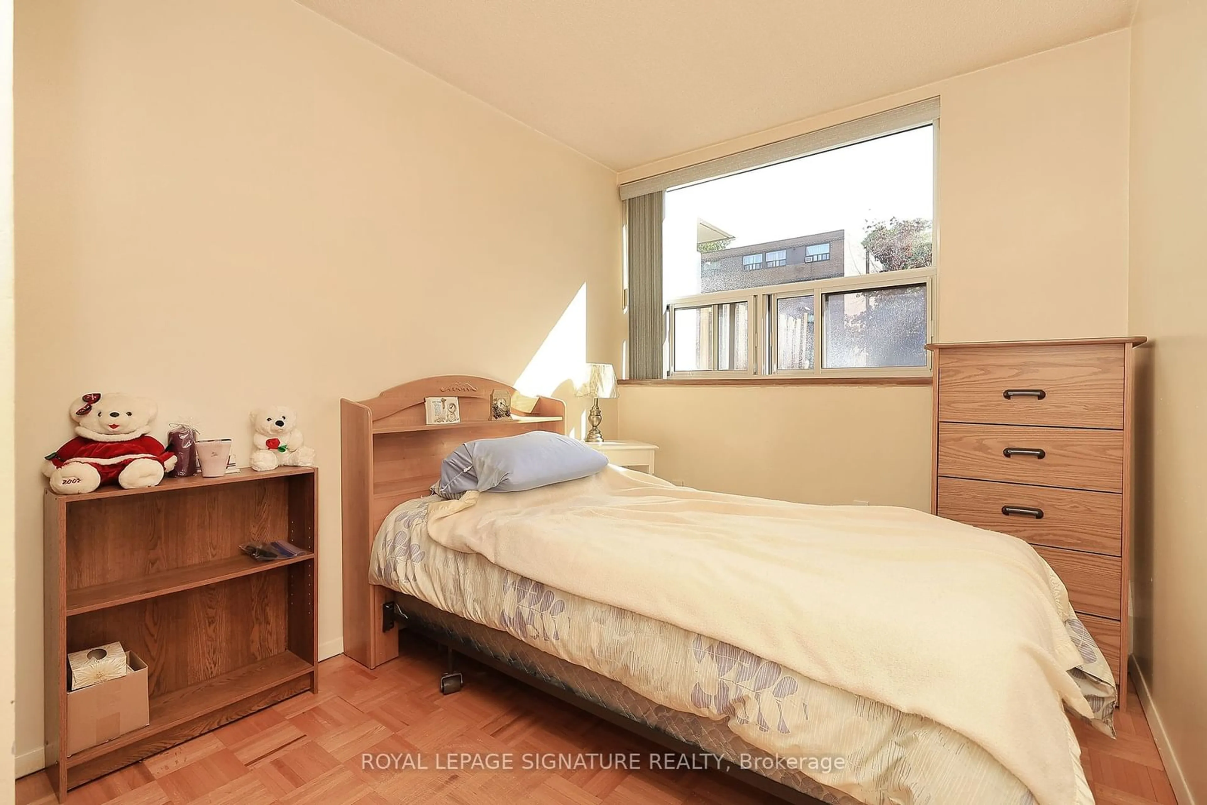 Bedroom with bed, wood/laminate floor for 20 Sunrise Ave #114, Toronto Ontario M4A 2R2