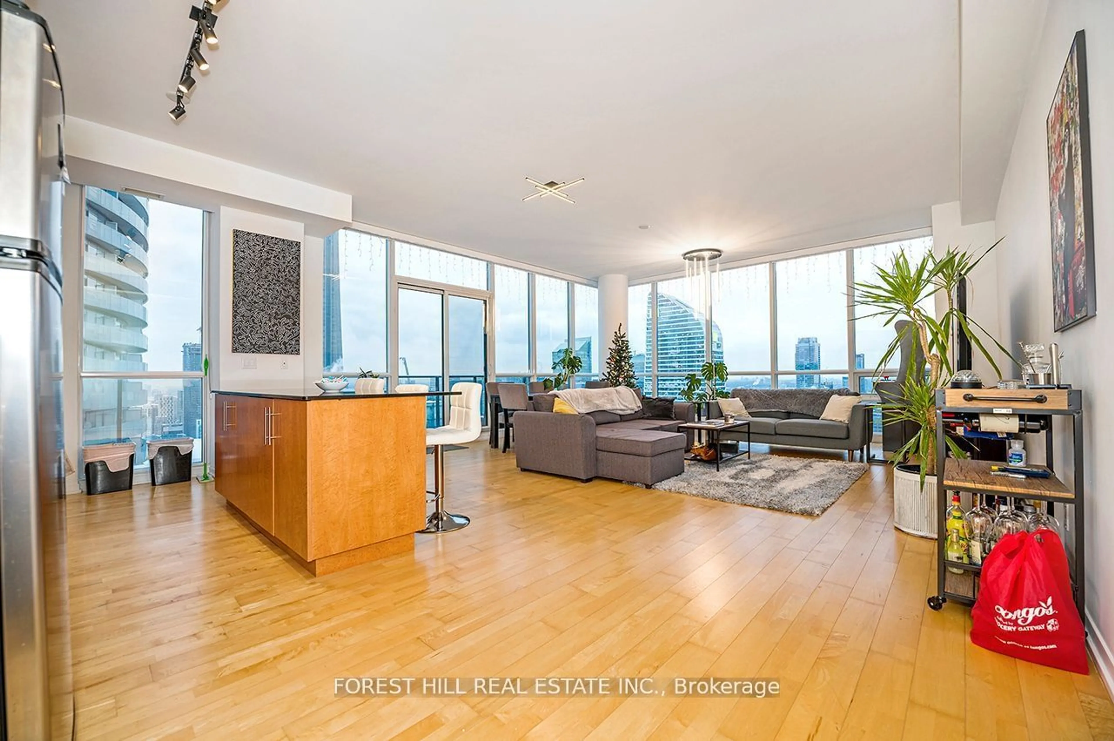 Living room with furniture, wood/laminate floor for 55 Bremner Blvd #PH 5001, Toronto Ontario M5J 0A6