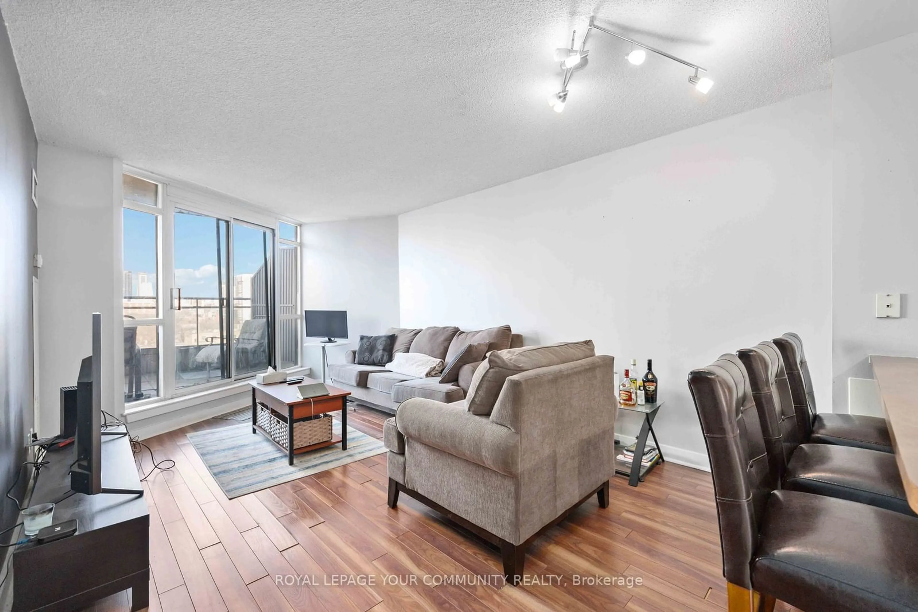 Living room with furniture, wood/laminate floor for 255 Richmond St #1010, Toronto Ontario M5A 4T7