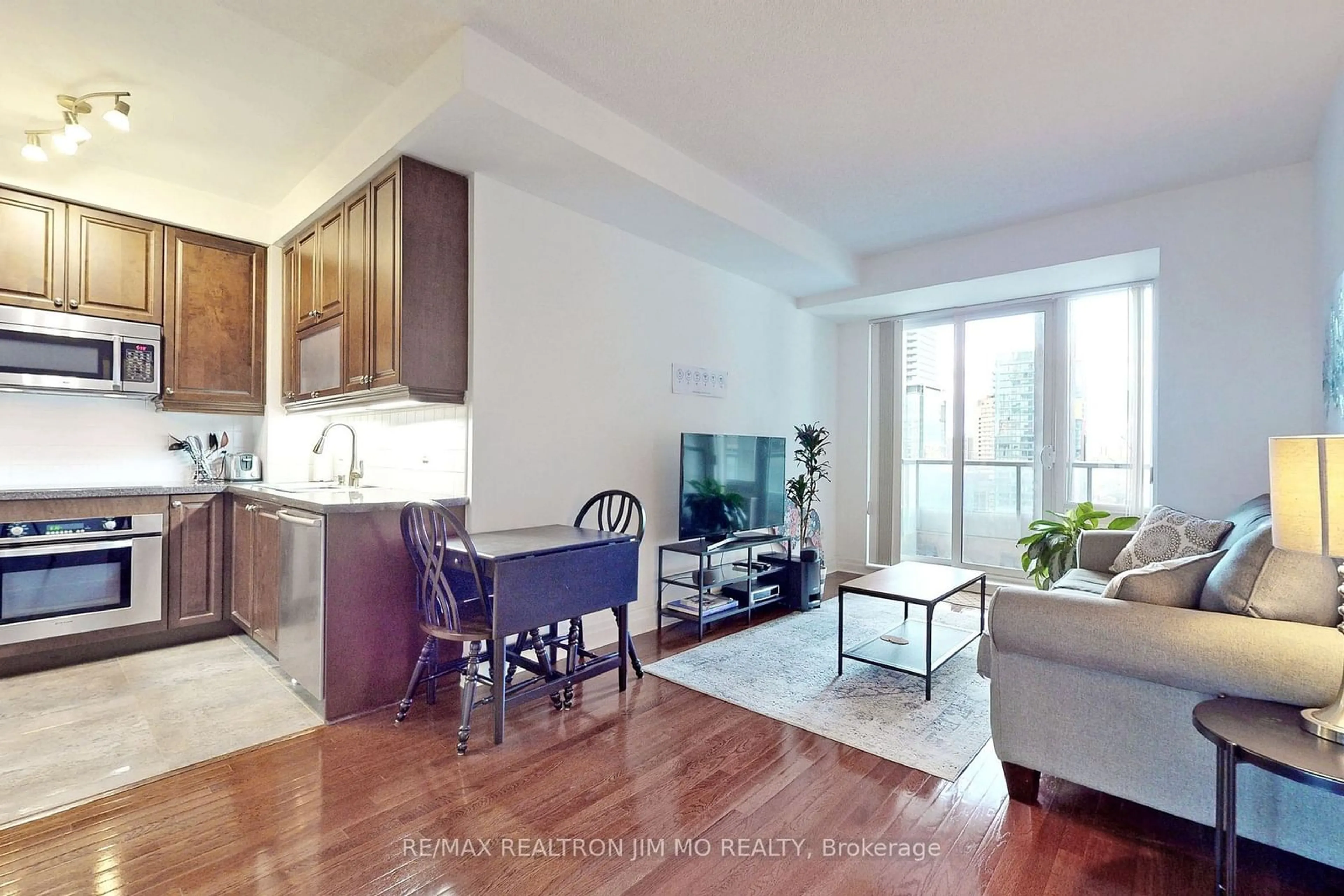 Living room with furniture, wood/laminate floor for 35 Balmuto St #1602, Toronto Ontario M4Y 0A3