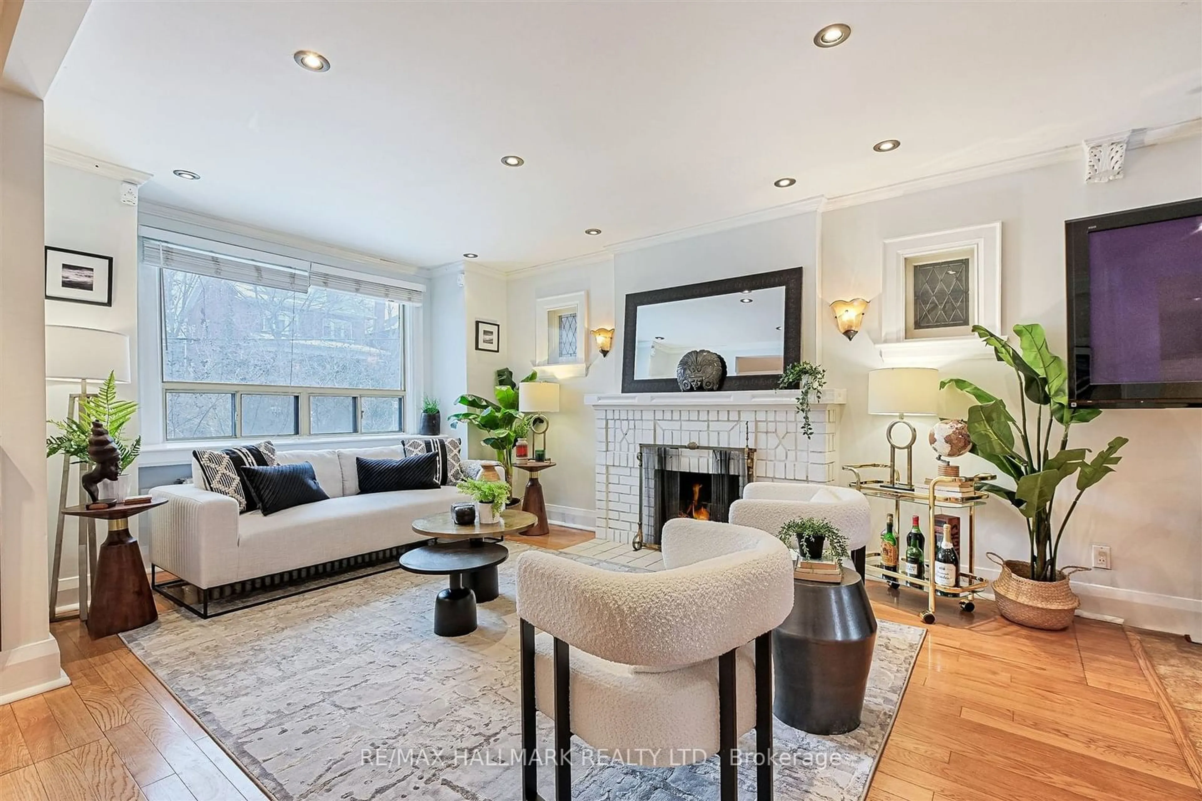 Living room with furniture, wood/laminate floor for 252 Winona Dr, Toronto Ontario M6C 3S2