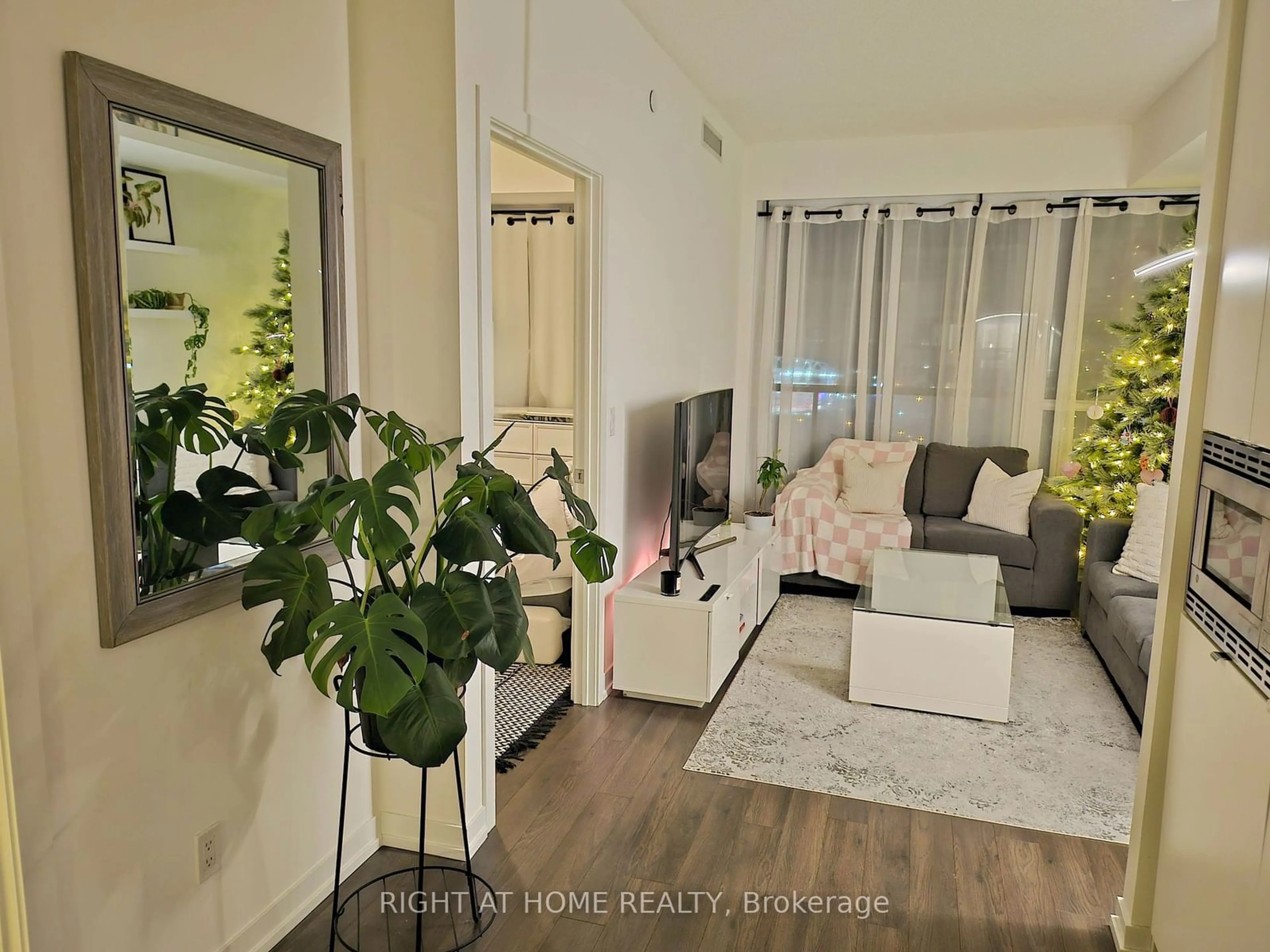 Living room with furniture, wood/laminate floor for 49 East Liberty St #2005, Toronto Ontario M6K 1A6