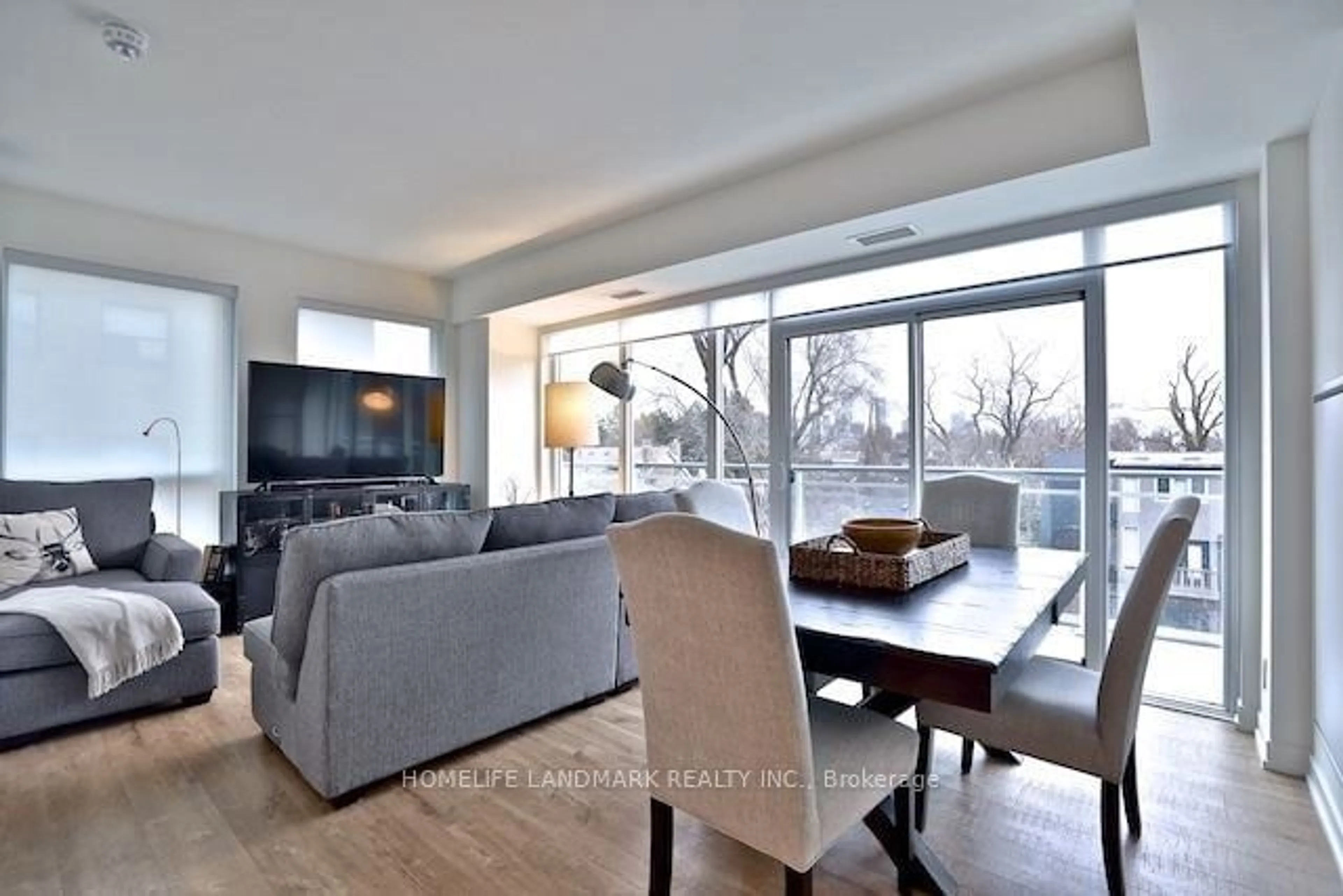 Living room with furniture, wood/laminate floor for 223 St Clair Ave #303, Toronto Ontario M4V 1R3