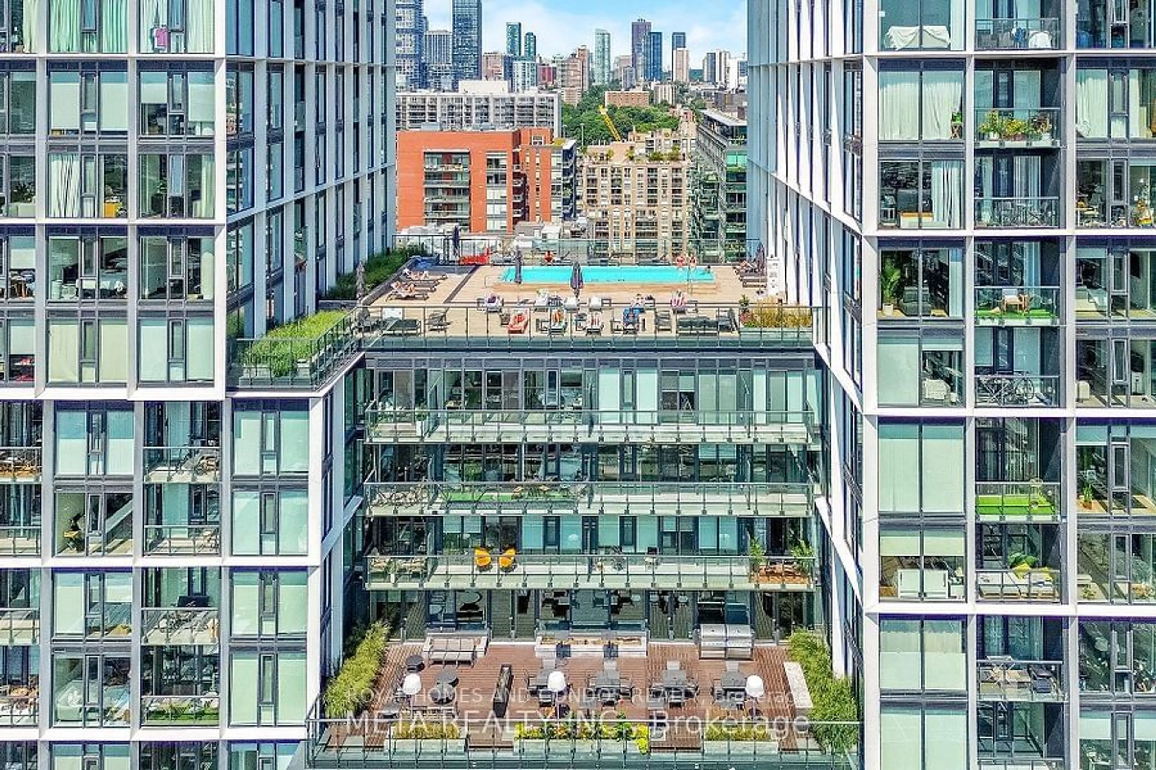 Patio, city buildings view from balcony for 158 Front St #1611, Toronto Ontario M5A 0K9