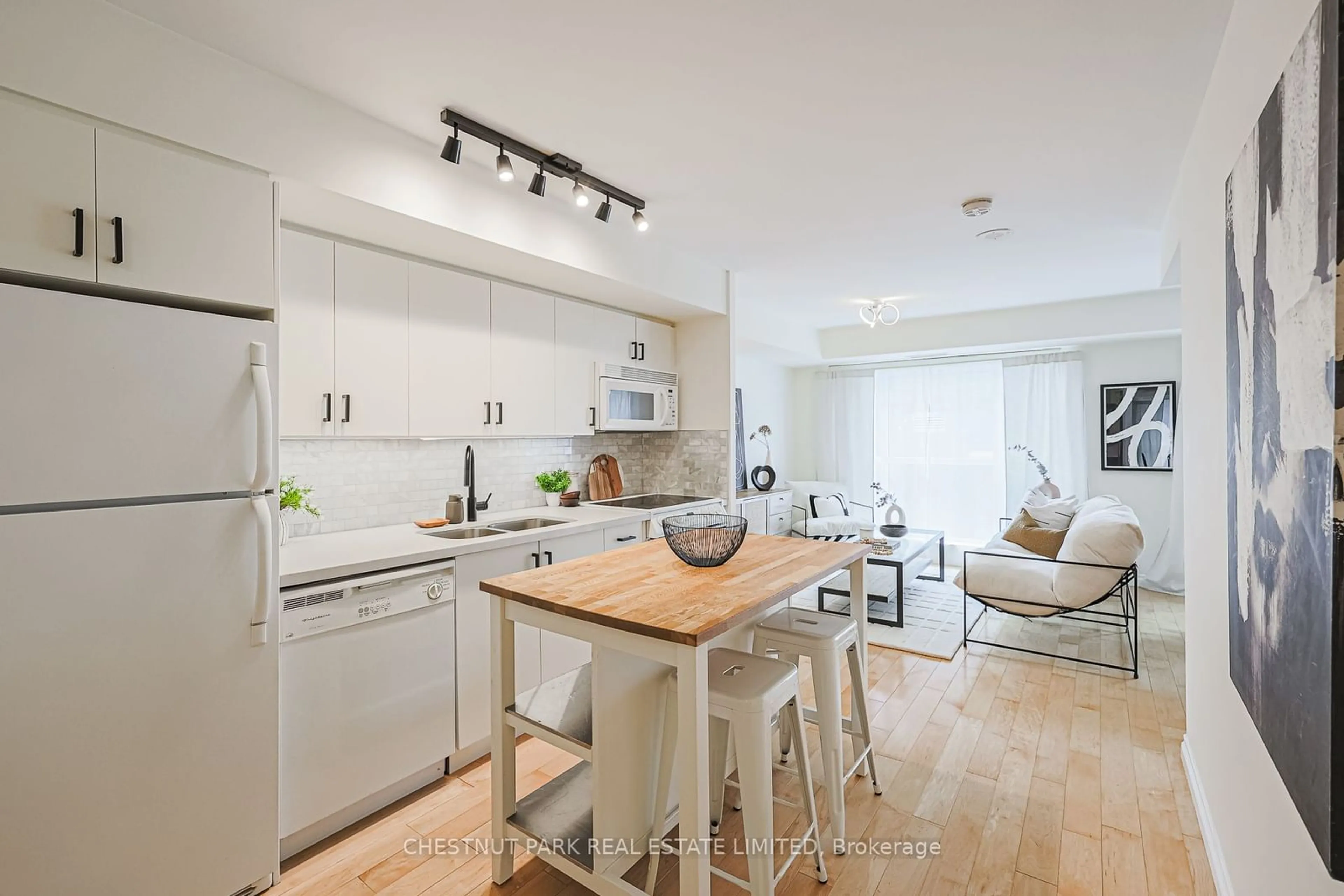 Open concept kitchen, wood/laminate floor for 18 Beverley St #218, Toronto Ontario M5T 3L2