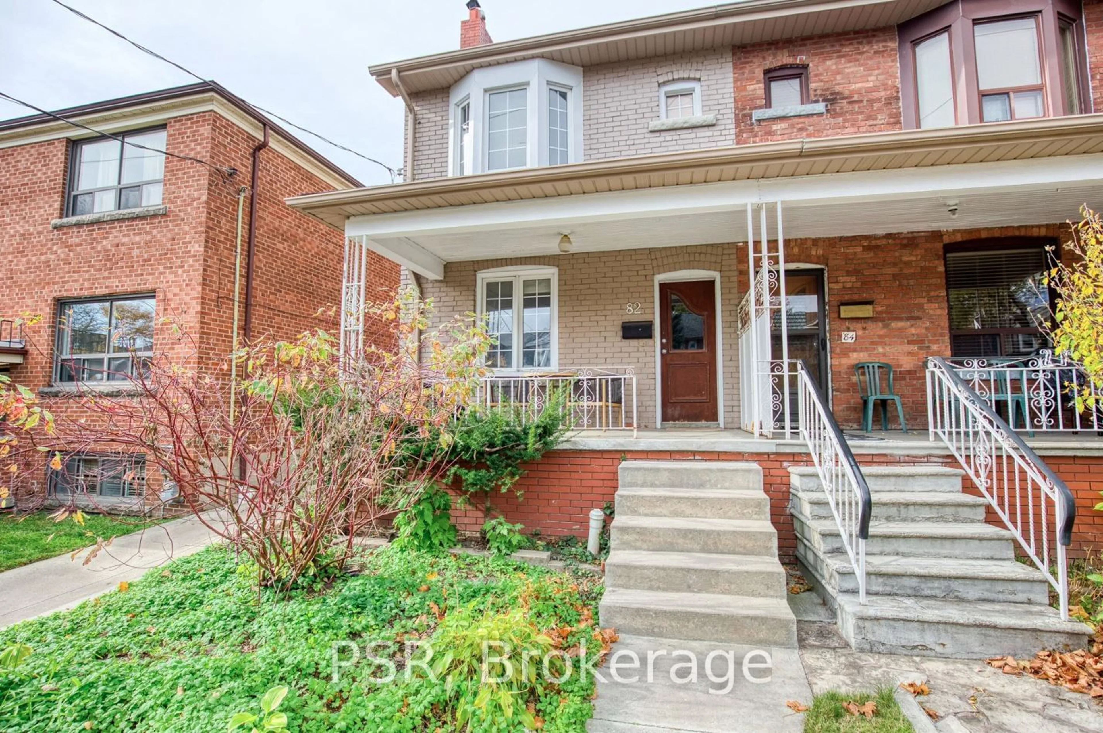 Home with brick exterior material, street for 82 Greensides Ave, Toronto Ontario M6G 3P7