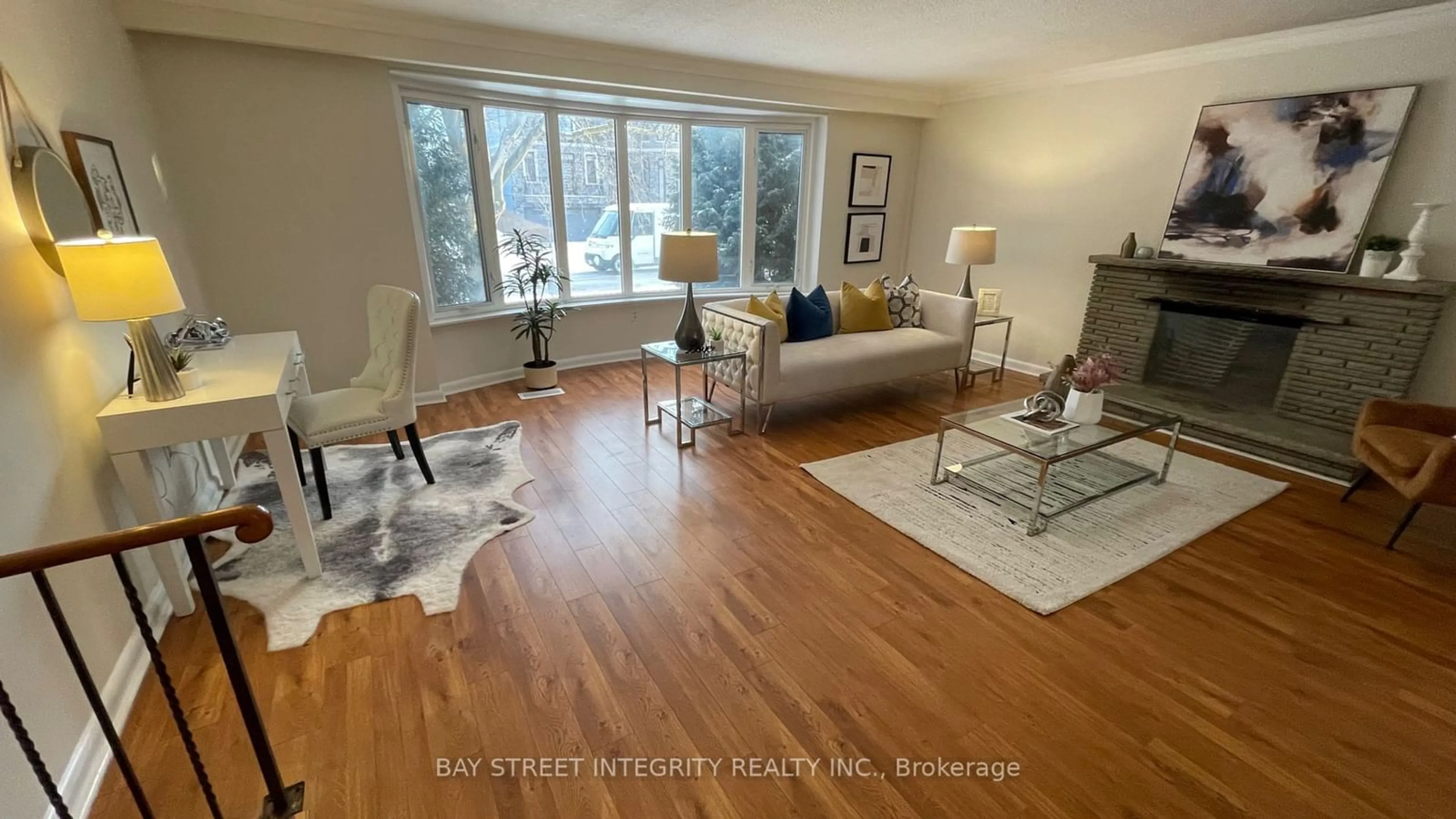 Living room with furniture, wood/laminate floor for 44 Bowerbank Dr, Toronto Ontario M2M 1Z8