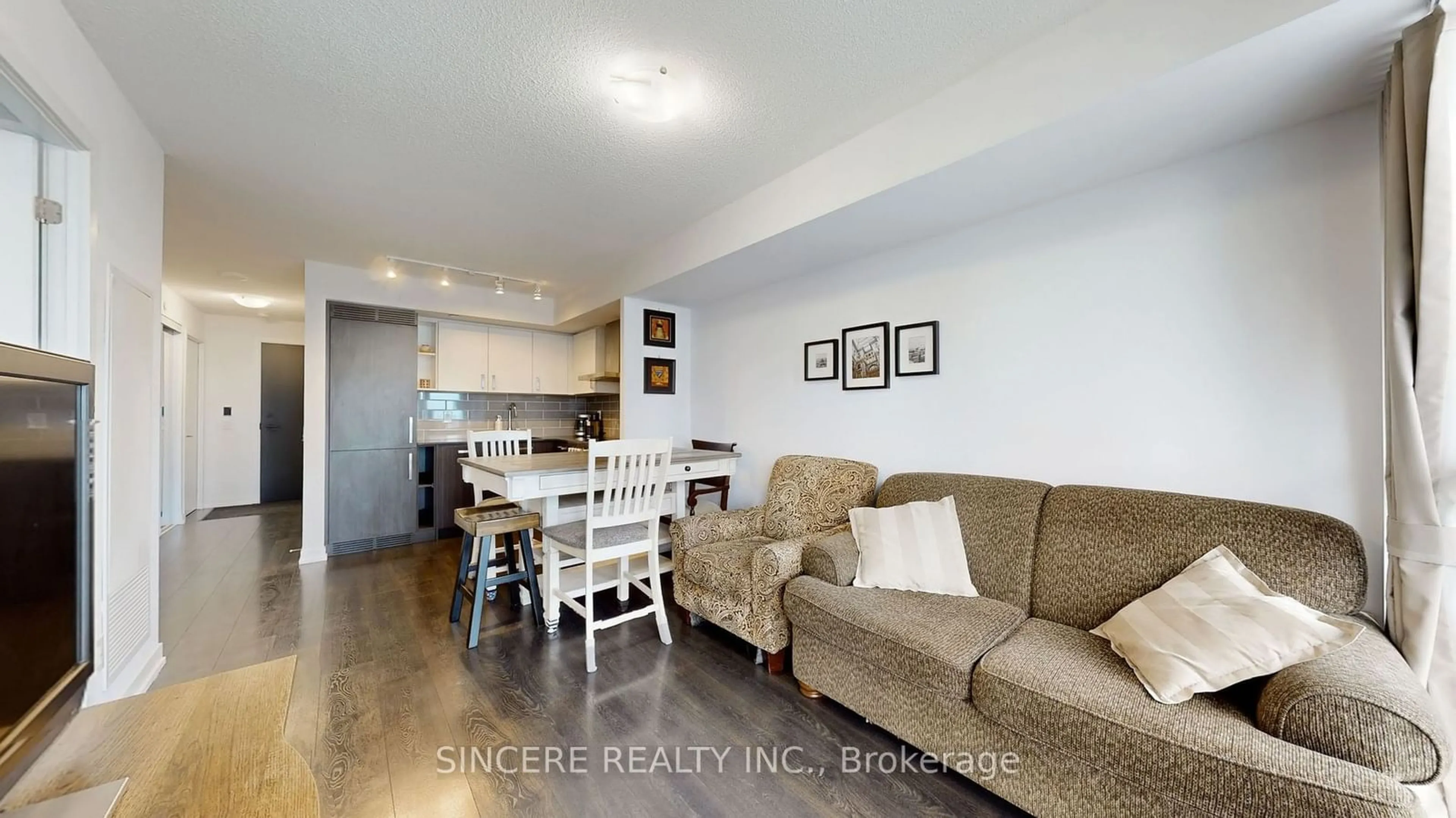 Living room with furniture, wood/laminate floor for 125 Redpath Ave #2507, Toronto Ontario M4S 0B5