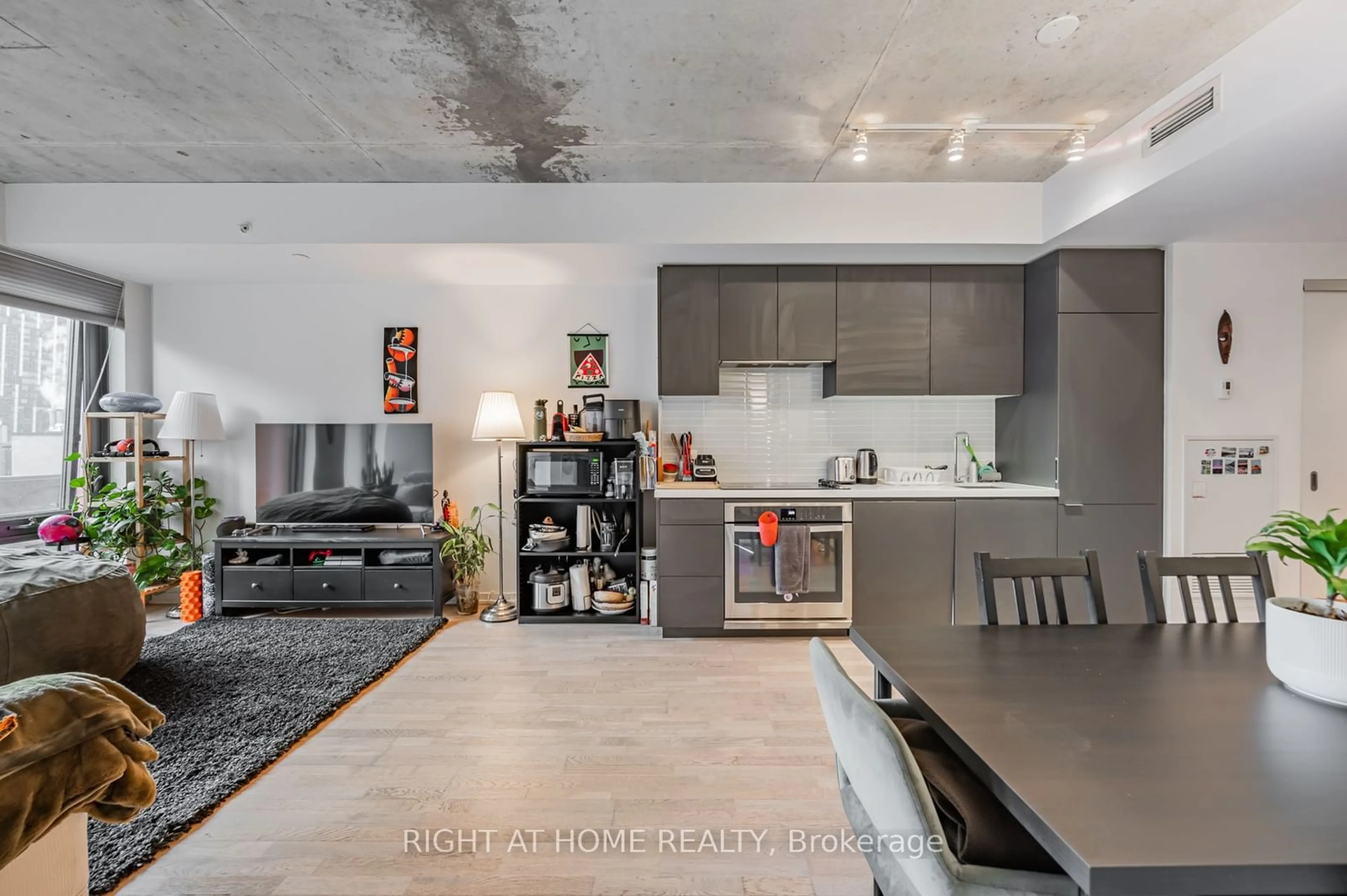 Open concept kitchen, cement floor for 60 Colborne St #615, Toronto Ontario M5E 1E3