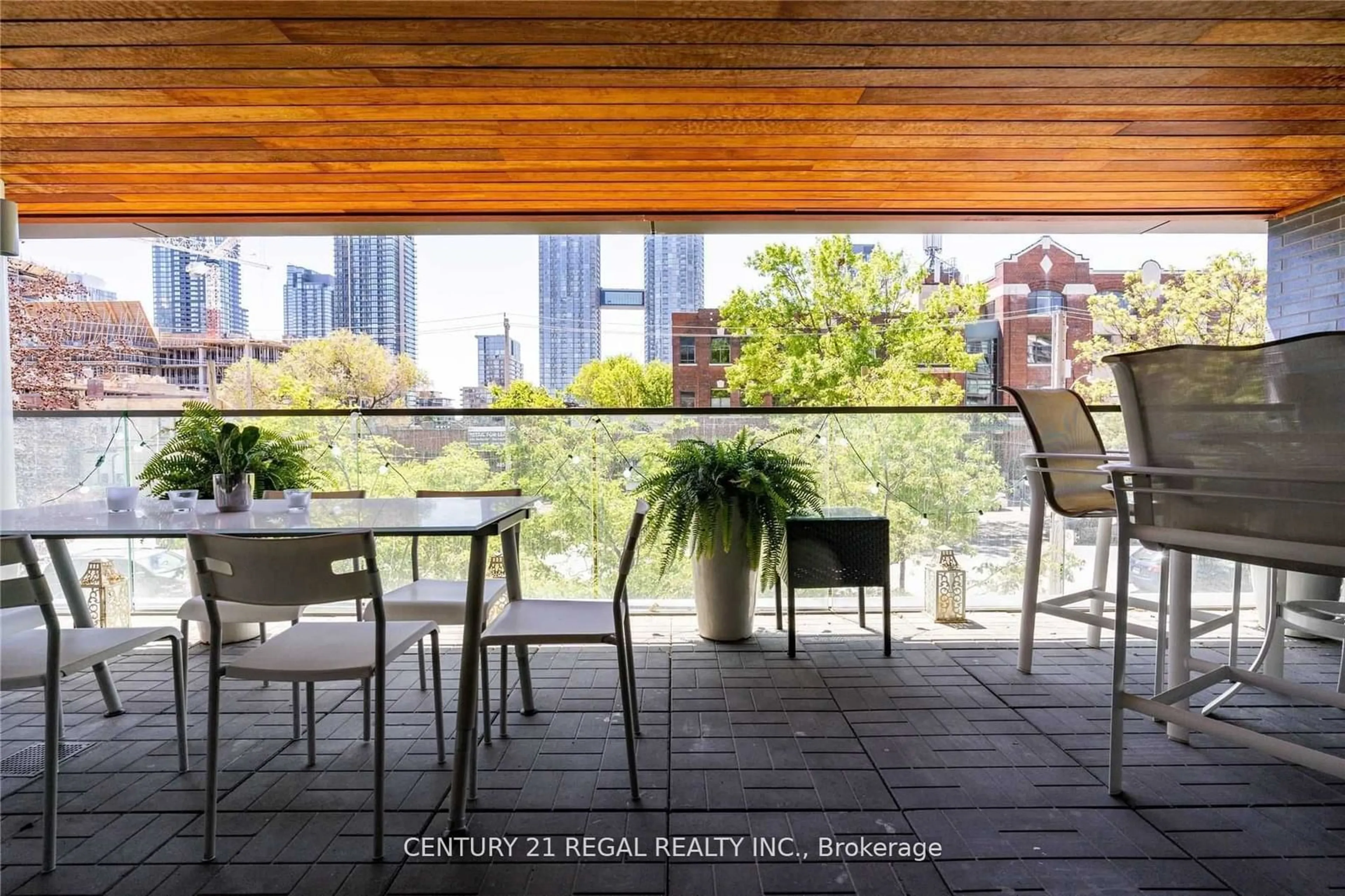 Patio, city buildings view from balcony for 500 Wellington St #201, Toronto Ontario M5V 1E3