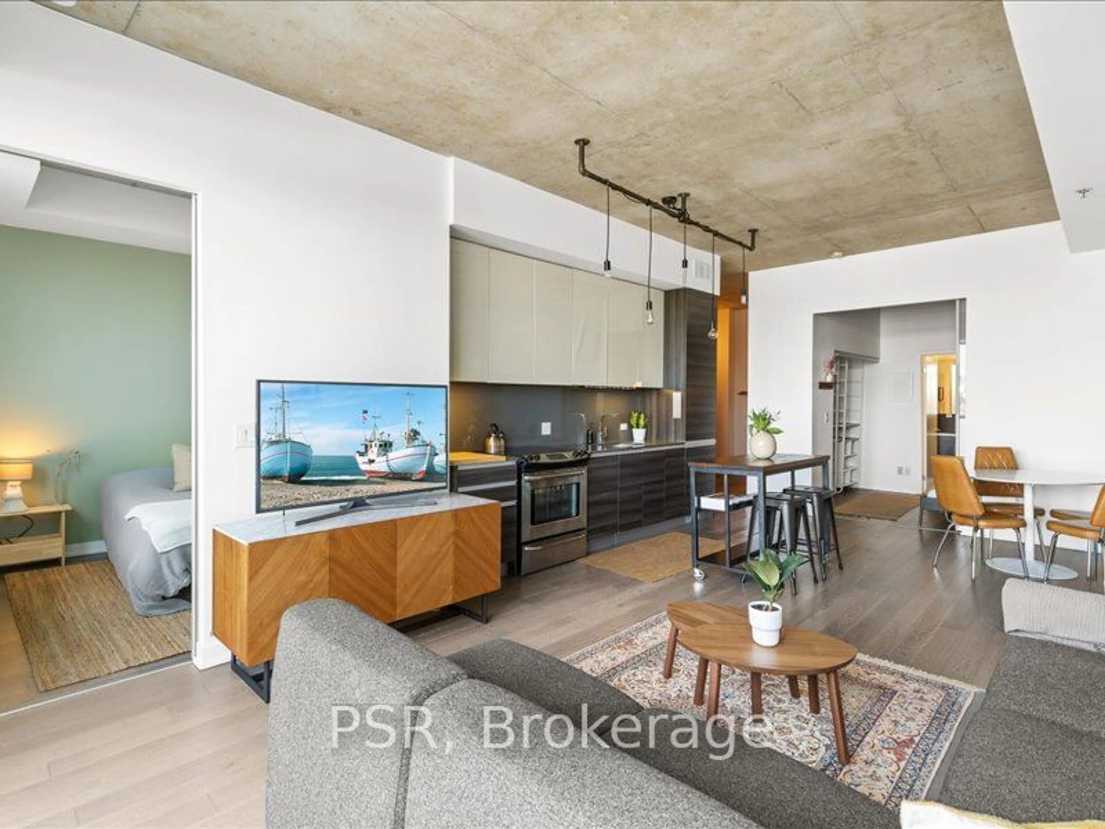 Open concept kitchen, cement floor for 8 Gladstone Ave #504, Toronto Ontario M6J 0B3